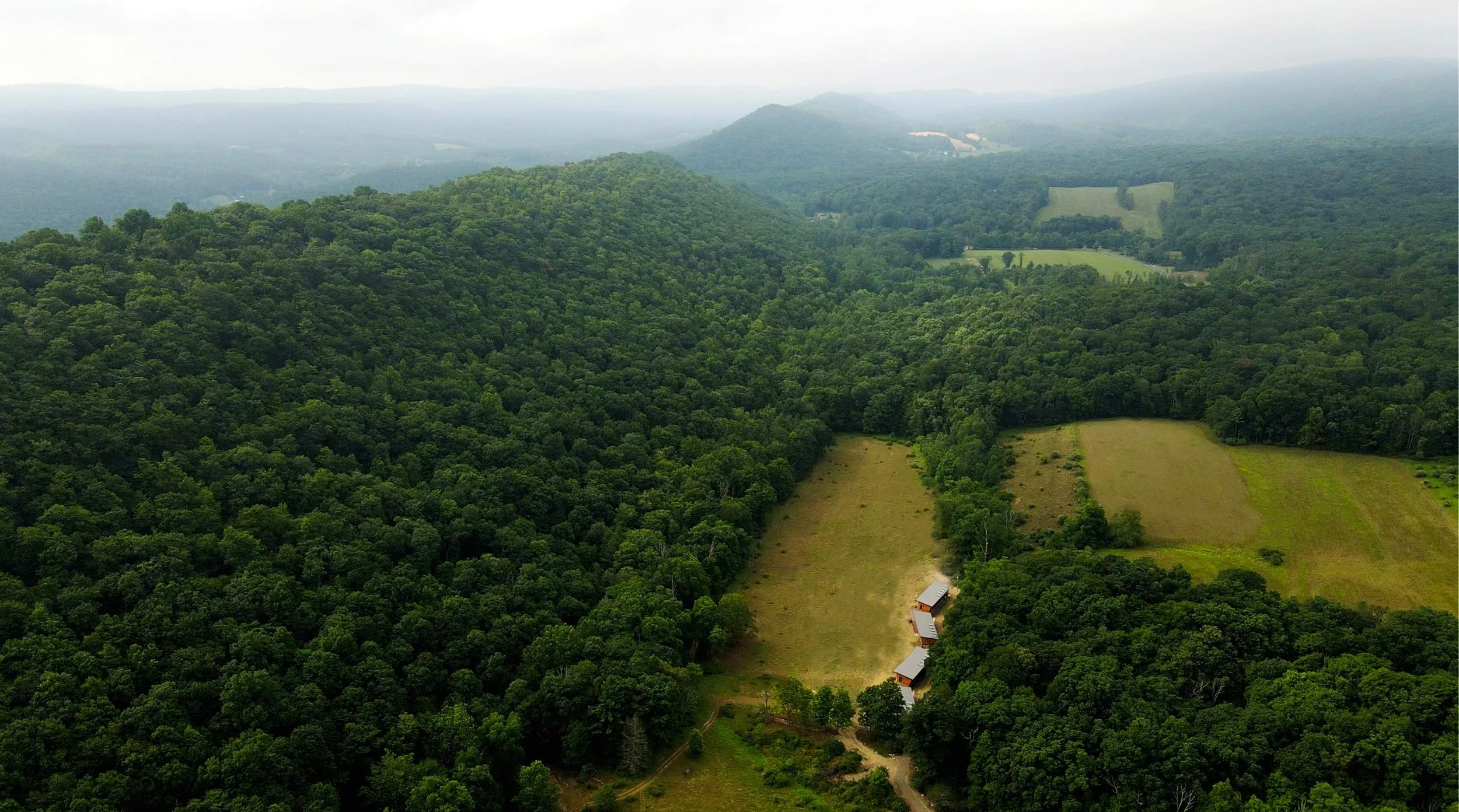 cabin-exterior-aerial-mountains.jpg