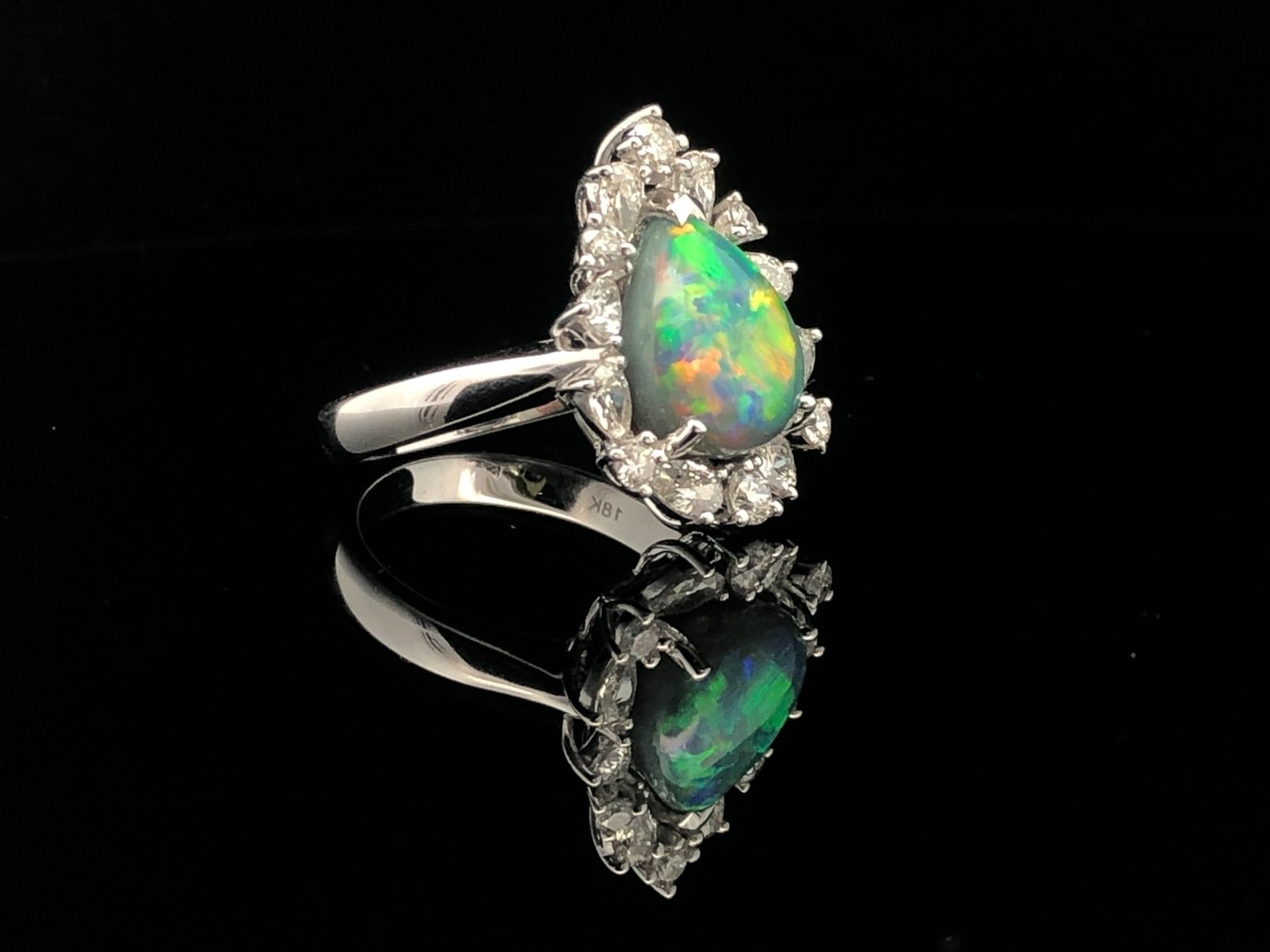 Side view of an 18K White Gold Lightning Ridge Black Opal and Diamond Ring