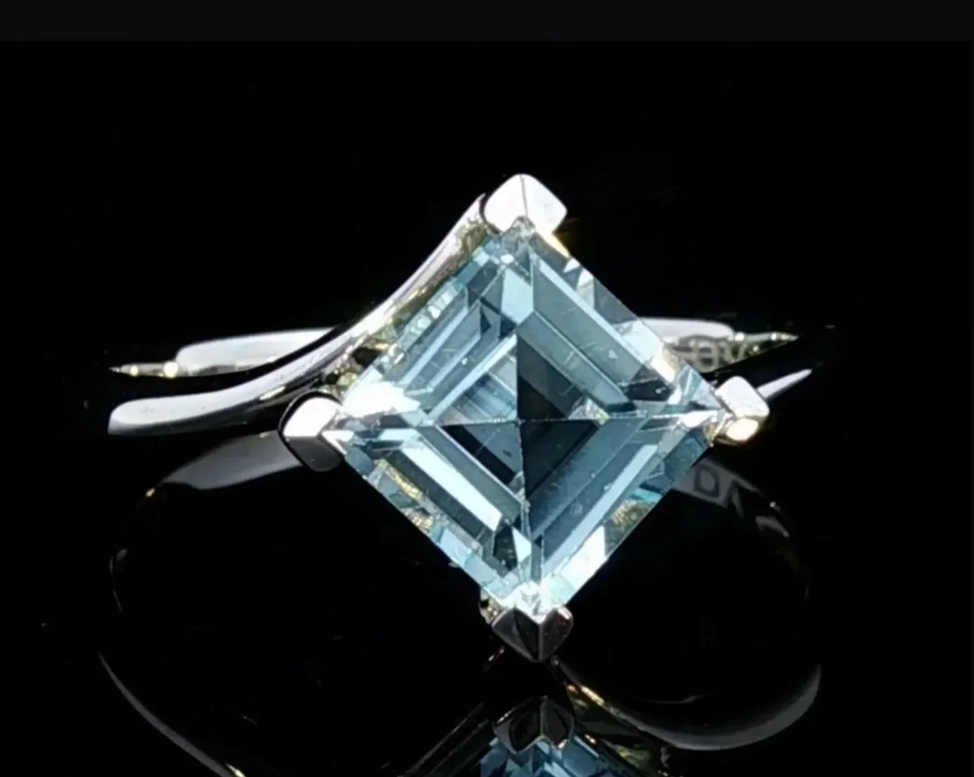9K White Gold Blue Topaz Ring