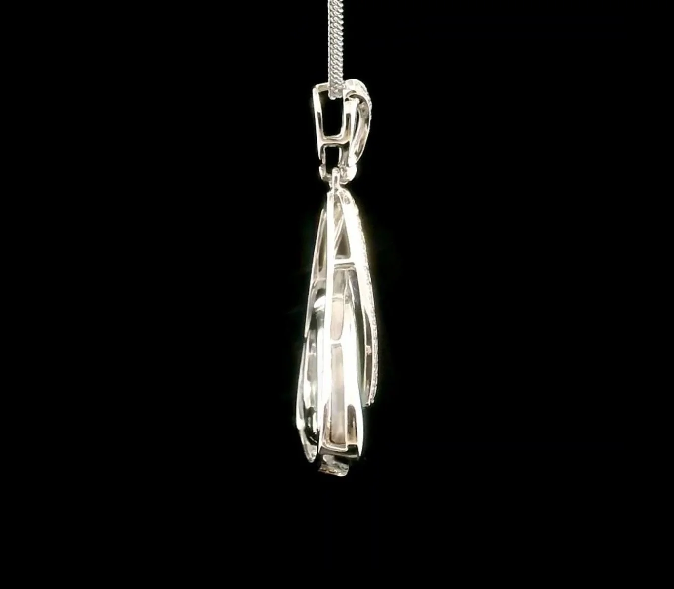 Left side view 18K White Gold Coober Pedy Light Opal and Diamond Pendant