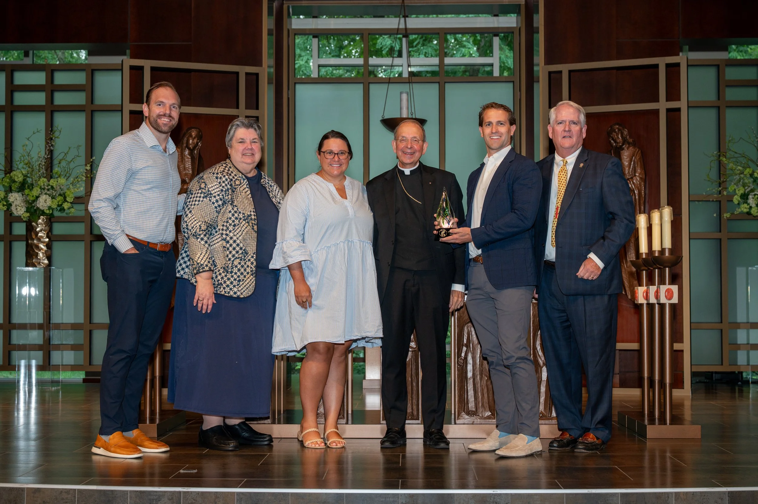 GB Charities accepts the Partner of the Year award from the Archdiocese of Baltimore at the 2026 Catholic Schools Convocation.