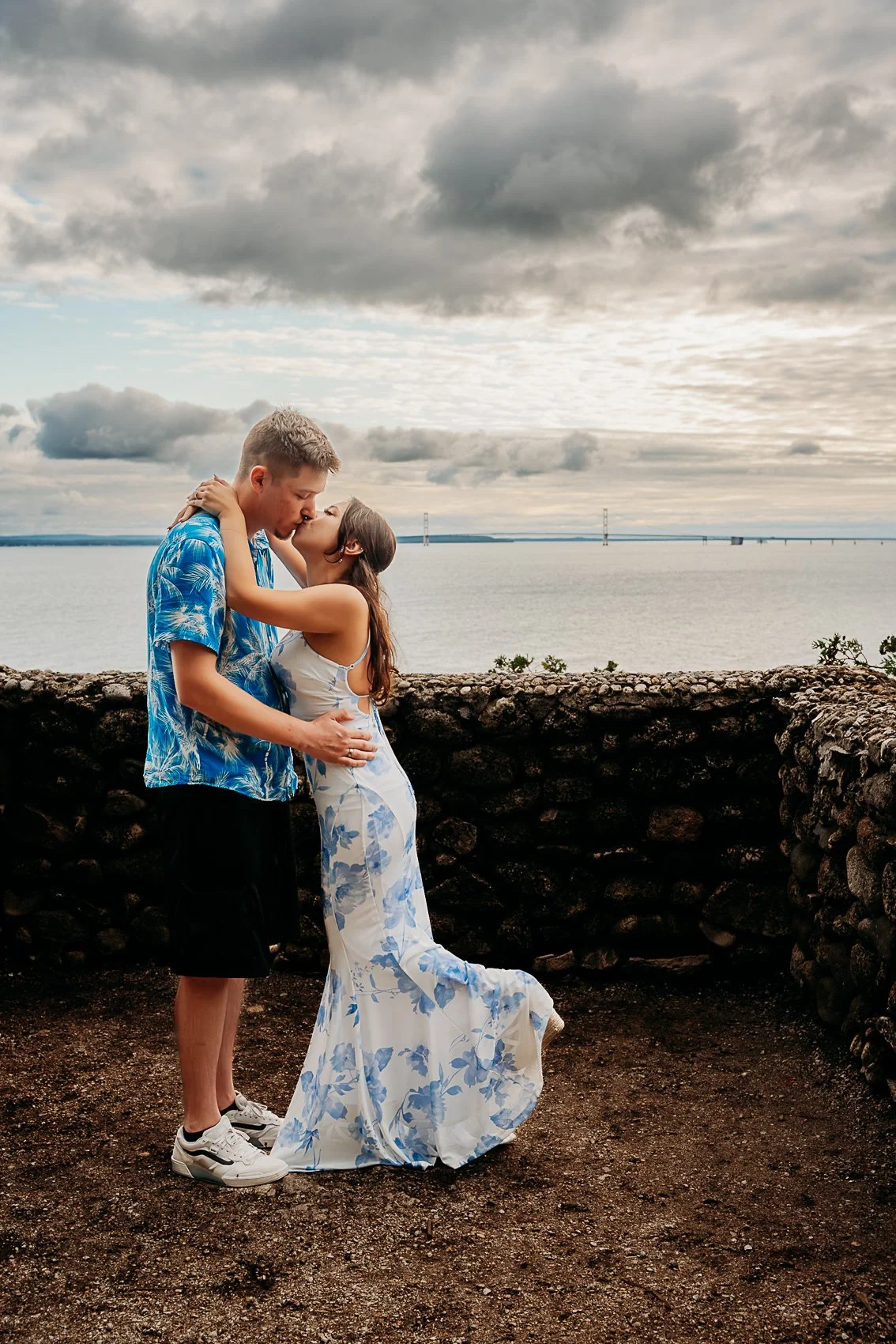 couple getting engaged at sunset rock near the inn at stonecliffe on mackinac island