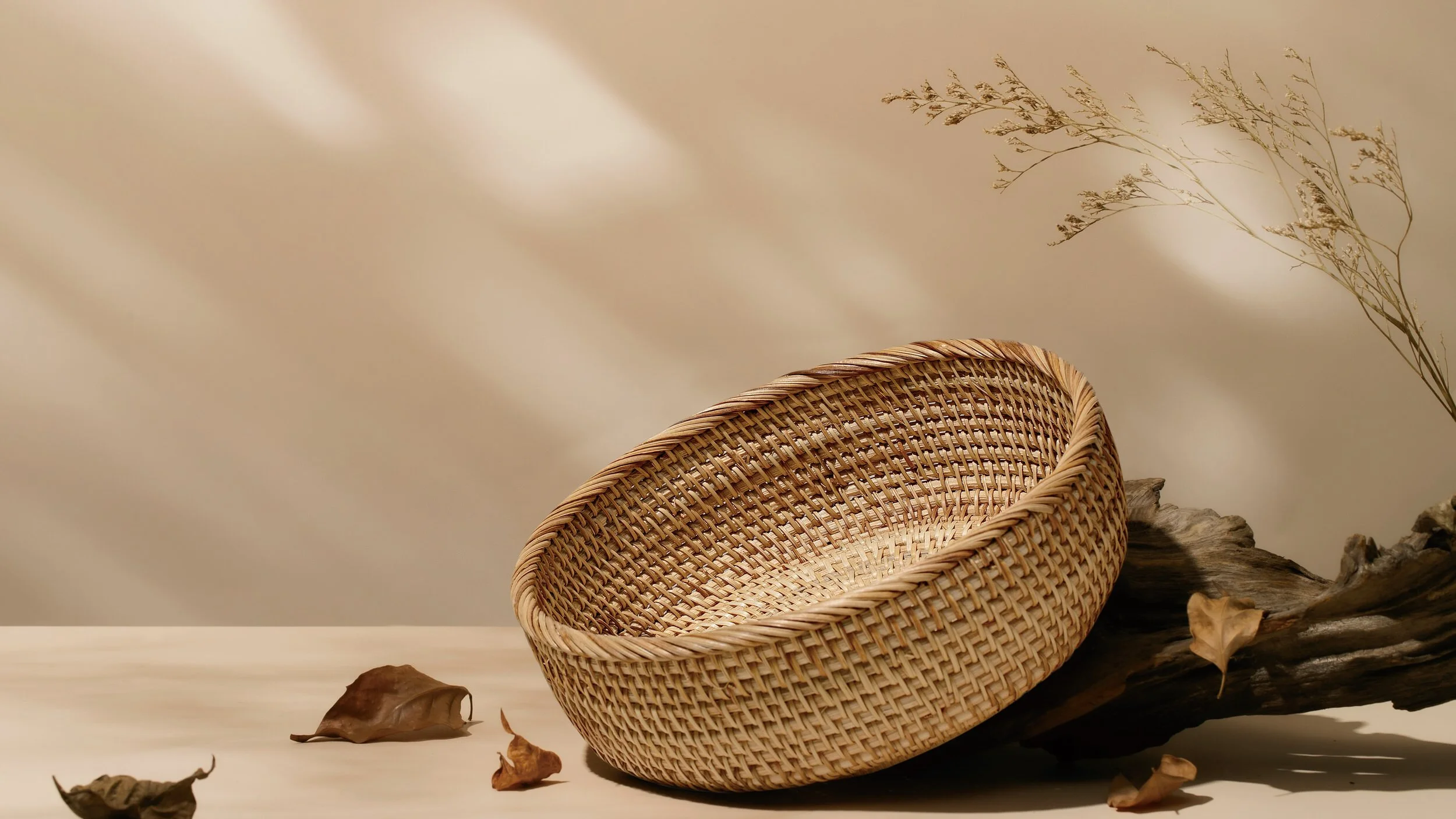 Handwoven rattan homeware by RattanVibe styled in a warm natural home setting