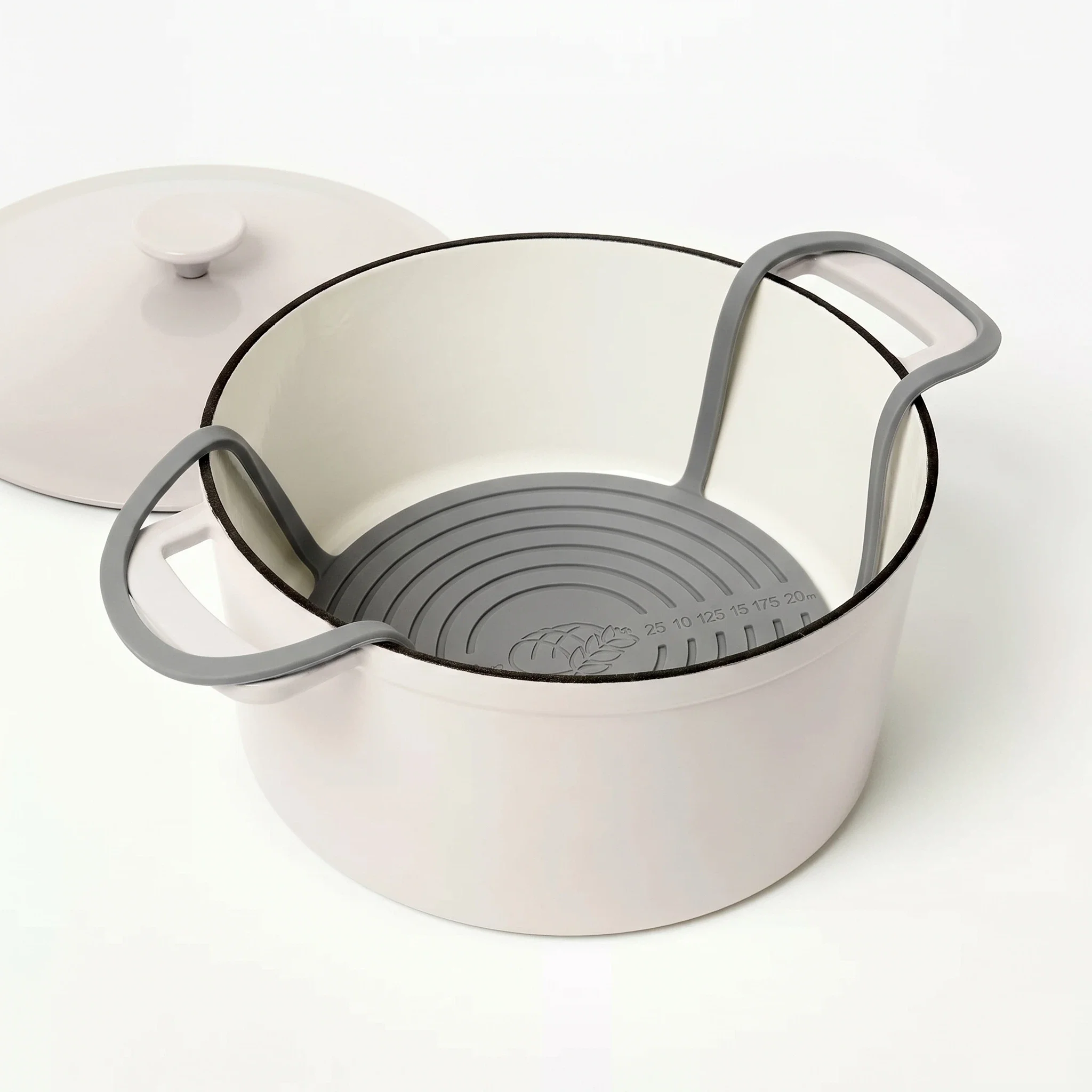 Gray round silicone bread sling for baking sourdough in a Dutch oven