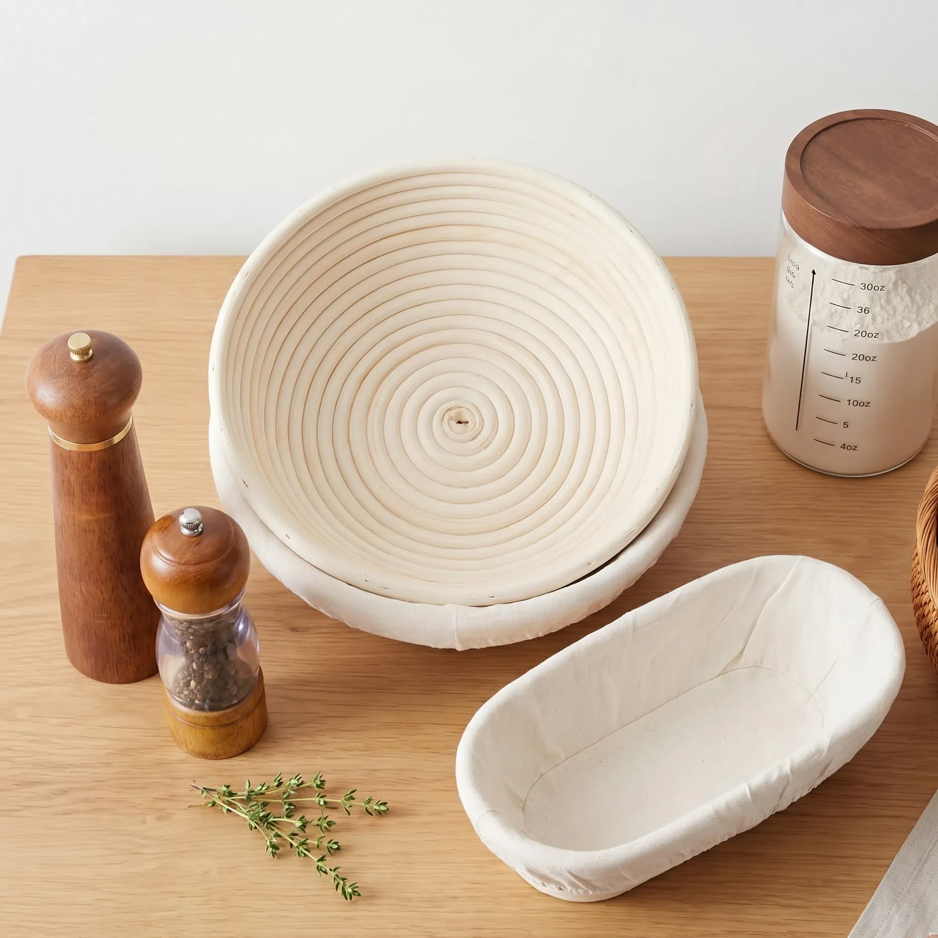 12-inch round and oval bread proofing baskets with cloth liners on a kitchen counter