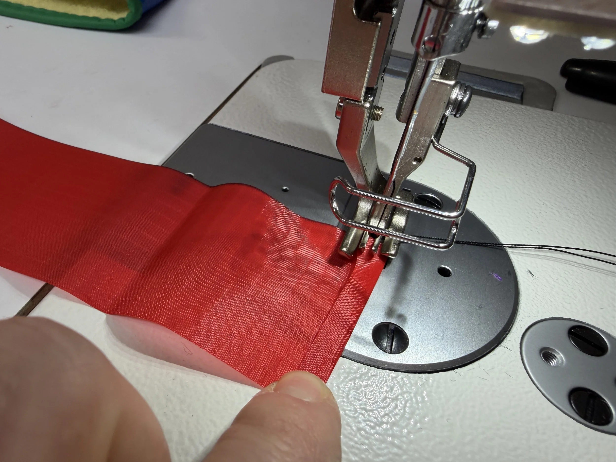 Fold 5mm over each end and stitch.