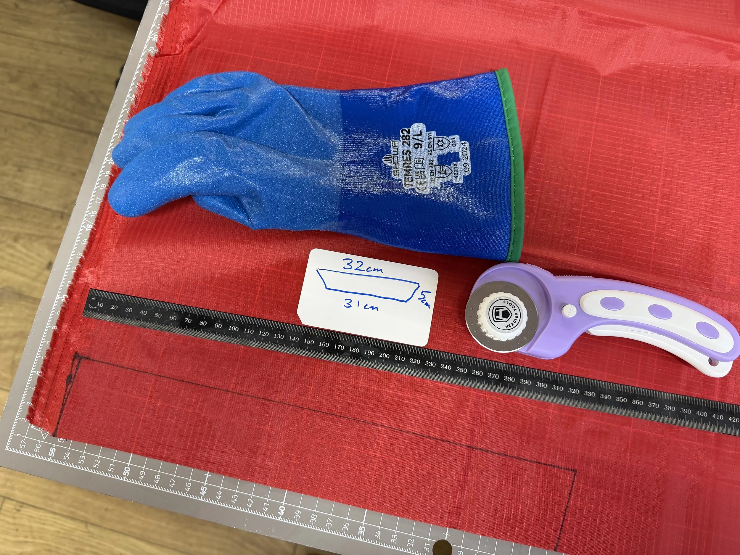 Cut the material to size. A slight trapezoid helps it be wider at the opening. 