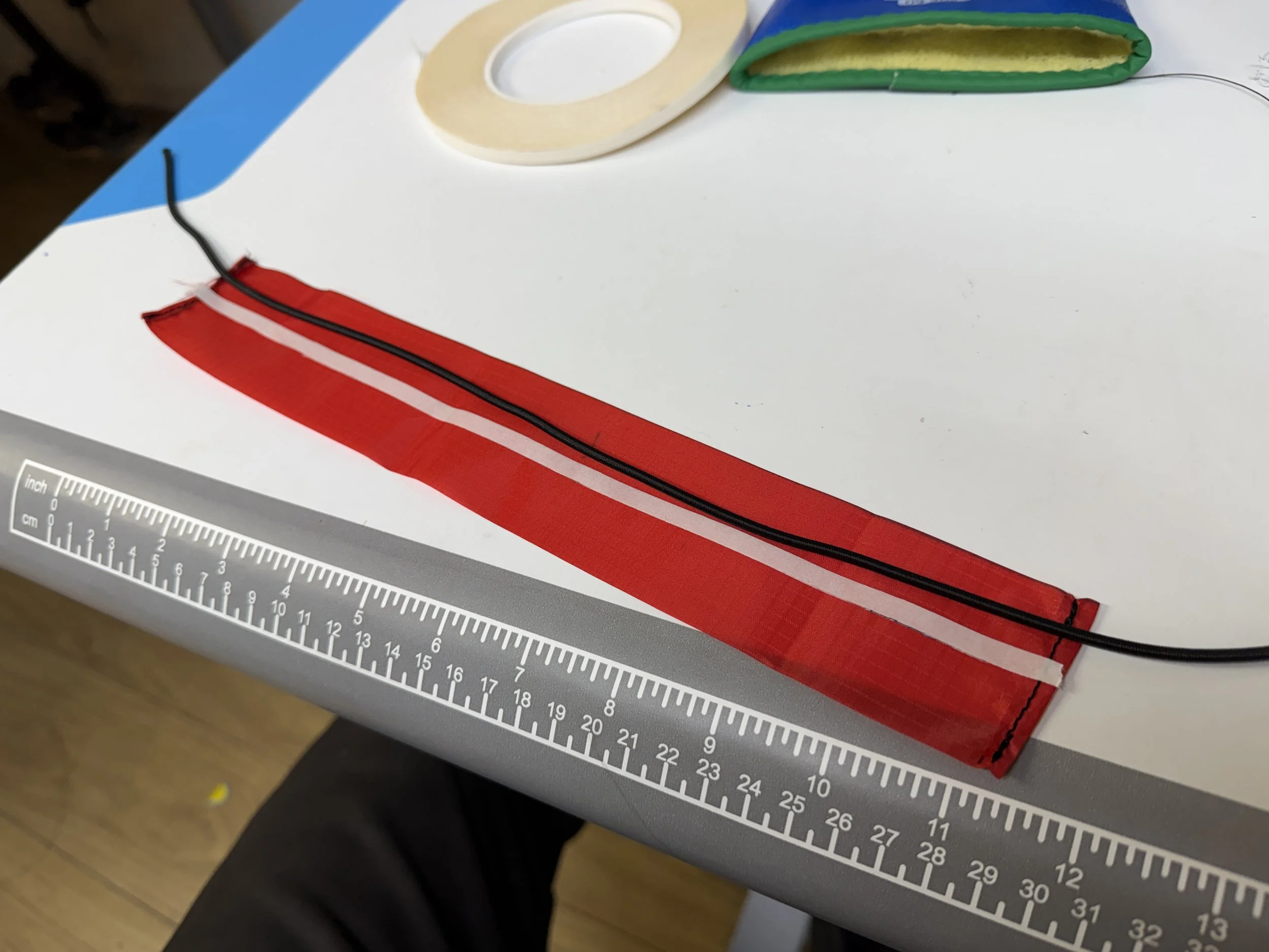 A little double sided tape helps line up the thin fabric