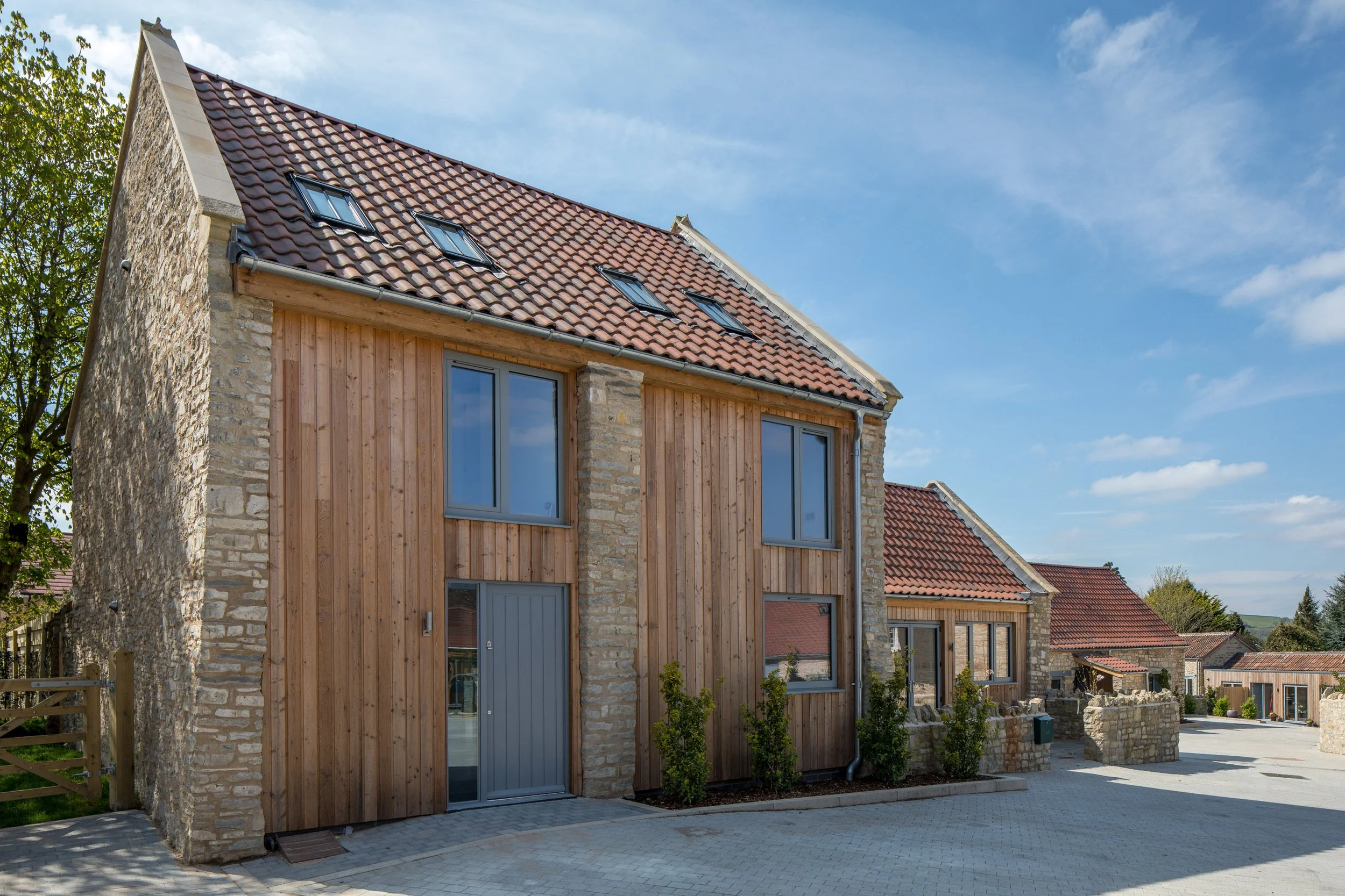 renovation and conversion of an existing Grade II listed farmhouse - residential conversion around central courtyard - sustainable timber interventions and stone features