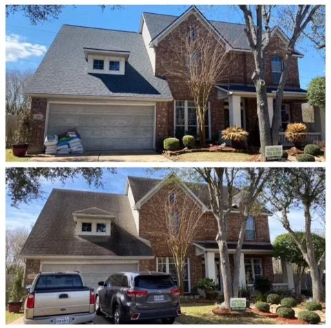 Front view of a two-story house with a brick facade, gray roof, and attached garage. Two cars are parked in the driveway.