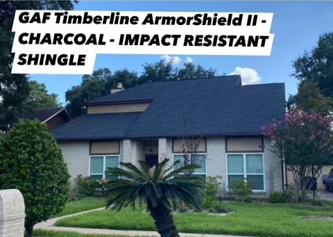 Front view of a house with a dark shingle roof and landscaped yard, including a palm tree and flowering bushes. Text overlay indicates it is GAF Timberline ArmorShield II shingles in Charcoal, impact resistant, and shingle.