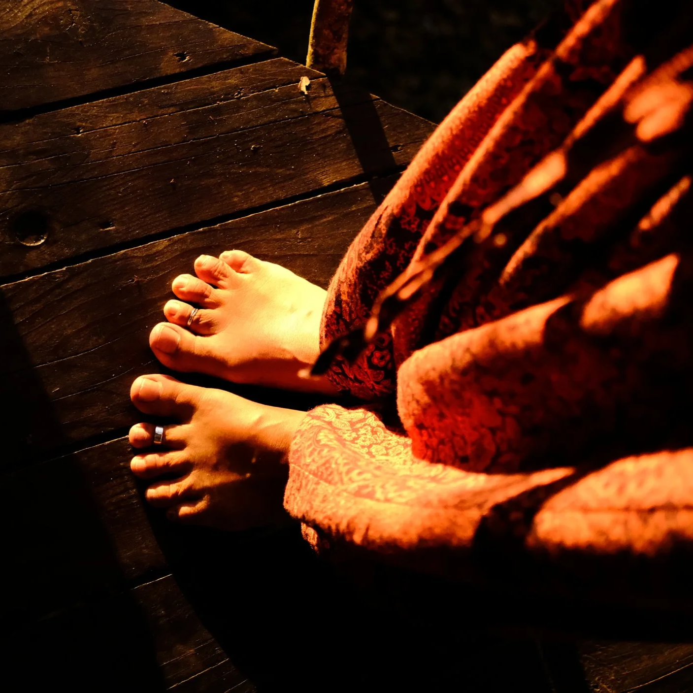 bare feet on wooden floor