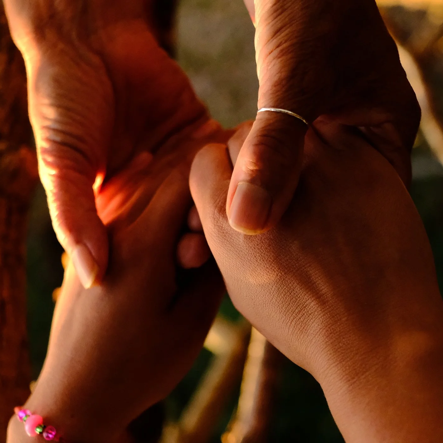 two women holding hands