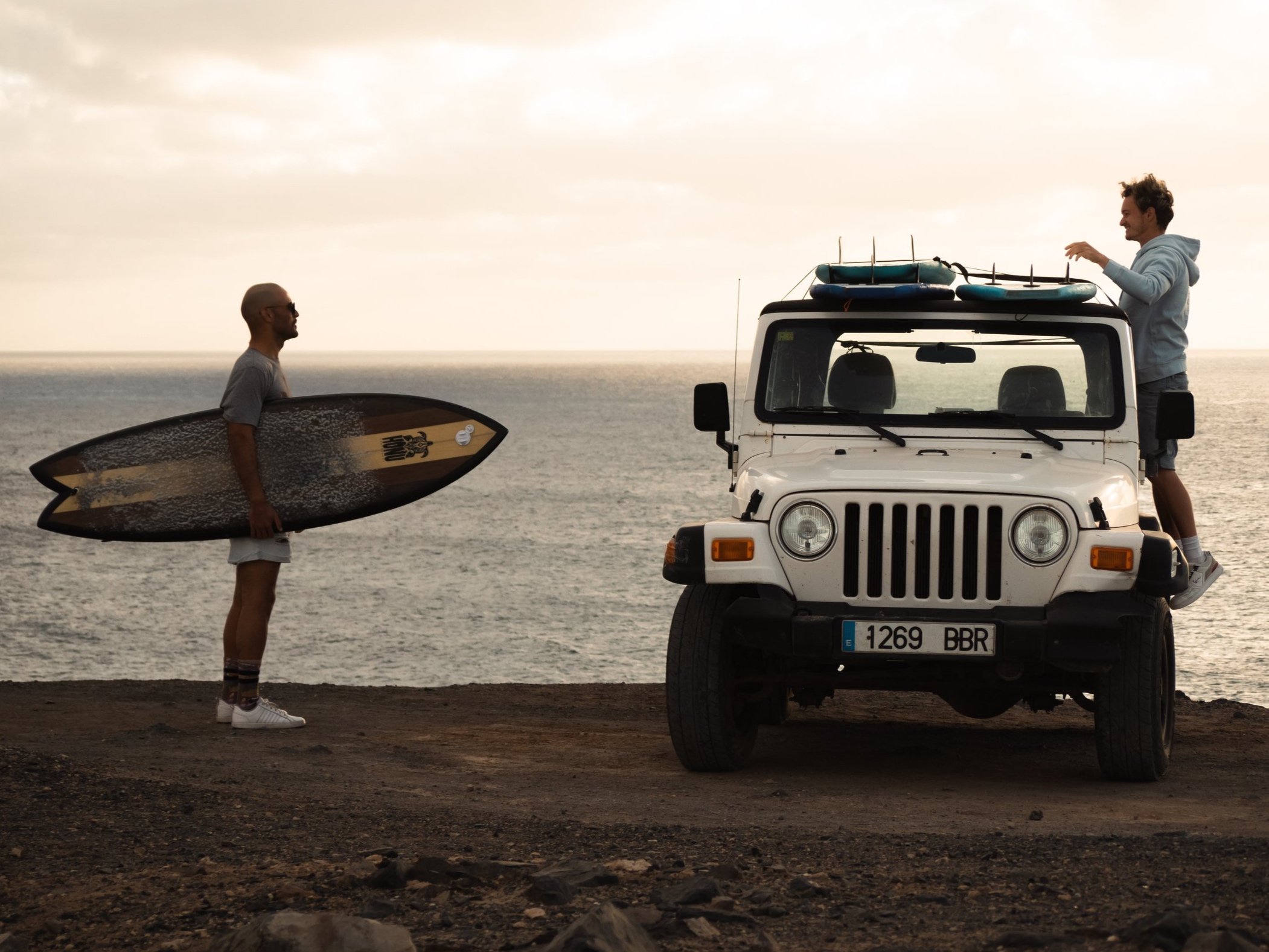 wil surfboard patrick on jeep.jpg
