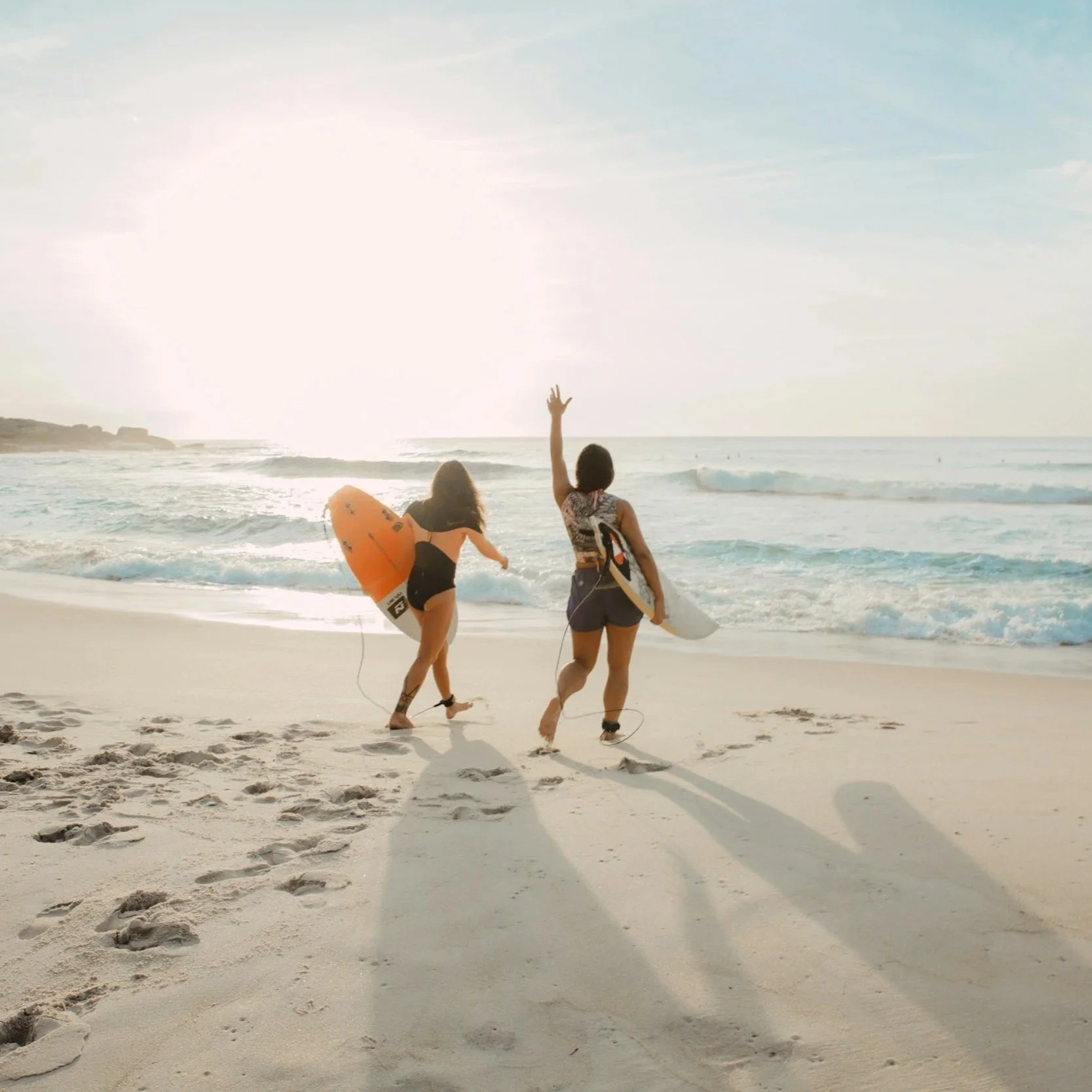 Girls Surfing Begginner waves in Fuerteventura Spain