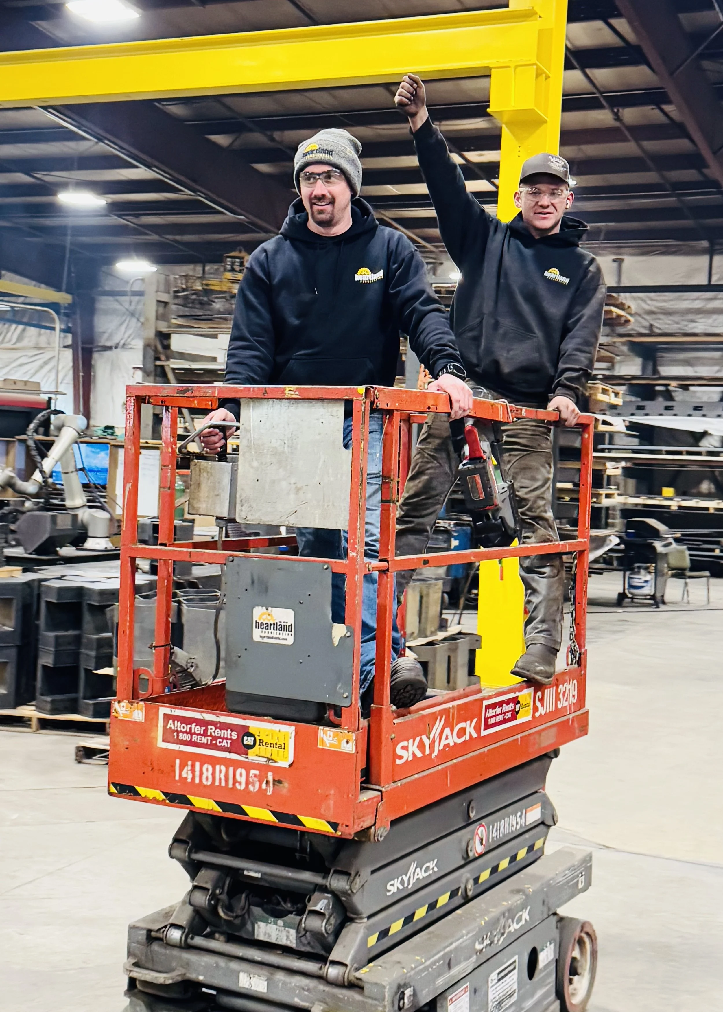 two men in fabrication shop