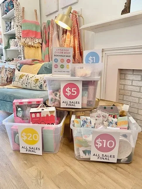 selection of sidewalk sale items in clearance bins