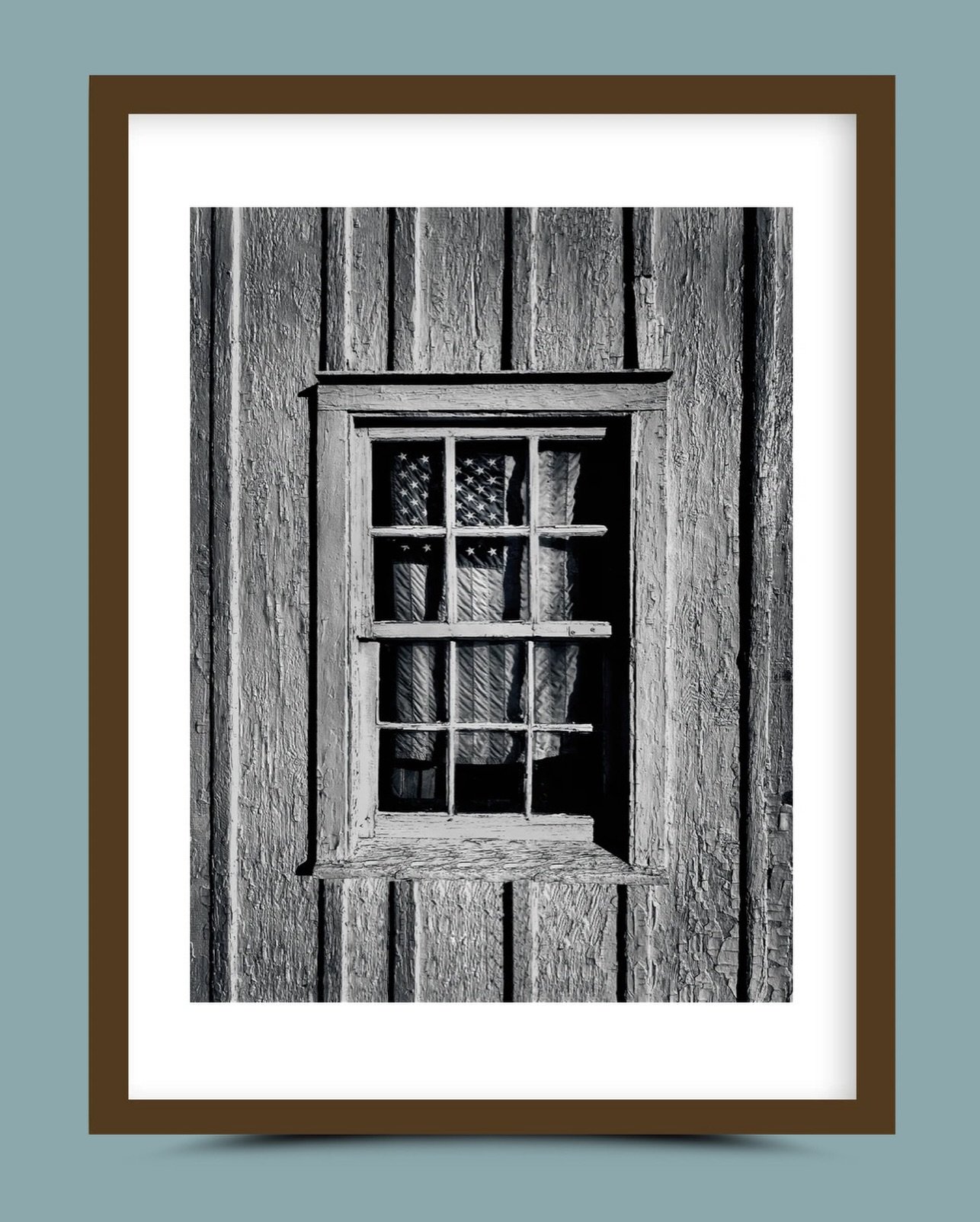 PRIDE, New York, 2020. - Framed by shadow and history, the flag becomes less a symbol of triumph and more a whisper of resilience &mdash; steadfast, intimate, enduring.

Visit our collection at NYCLimitedEdition.com