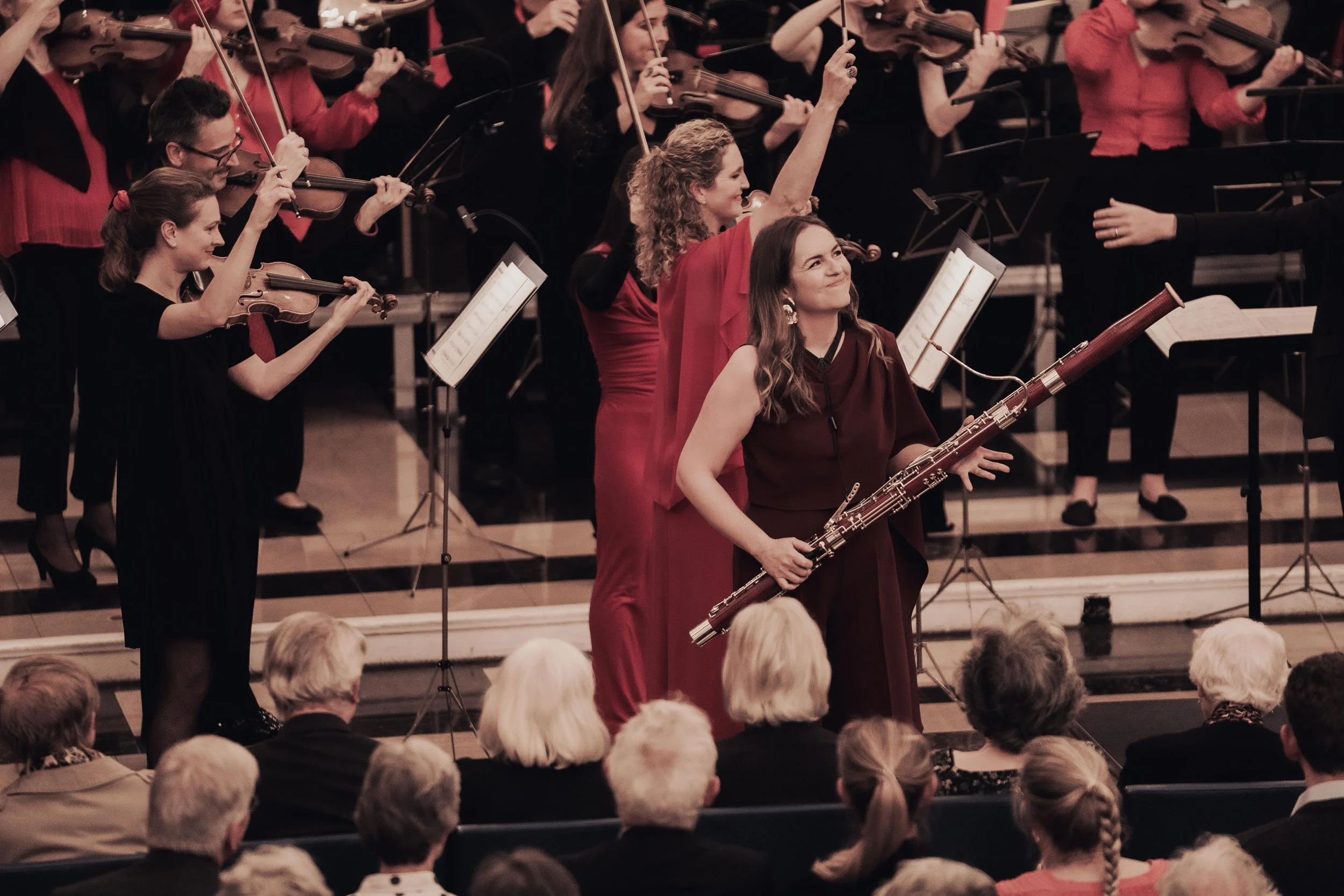 Amy smiling live performance 2026 burgundy dress.jpeg