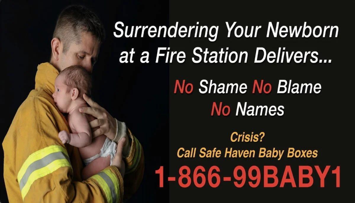 A firefighter holding a newborn baby in his arms with a black background. The image contains text promoting safe haven baby boxes with a phone number for help.