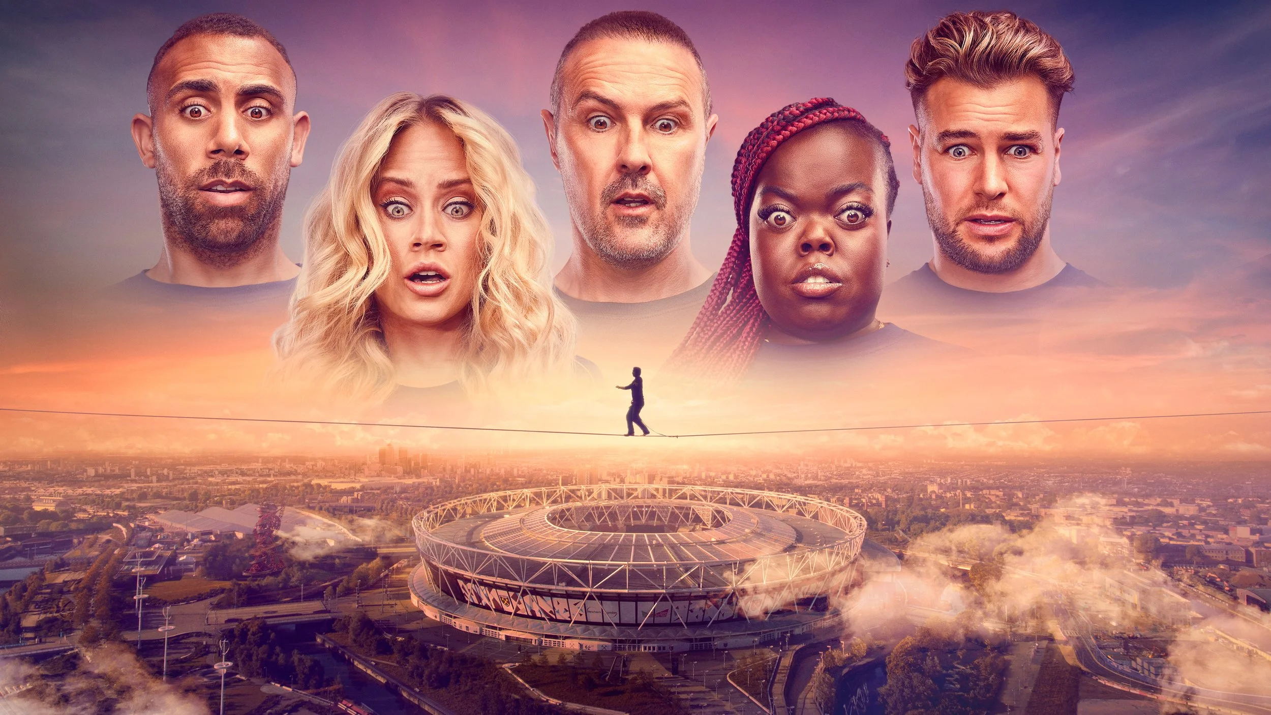 A large football stadium is depicted in the foreground with a cityscape in the background. Above, five giant floating heads of diverse individuals with surprised expressions dominate the sky. One person is walking on a tightrope-like line connecting the stadiums, set against a sunset sky.
