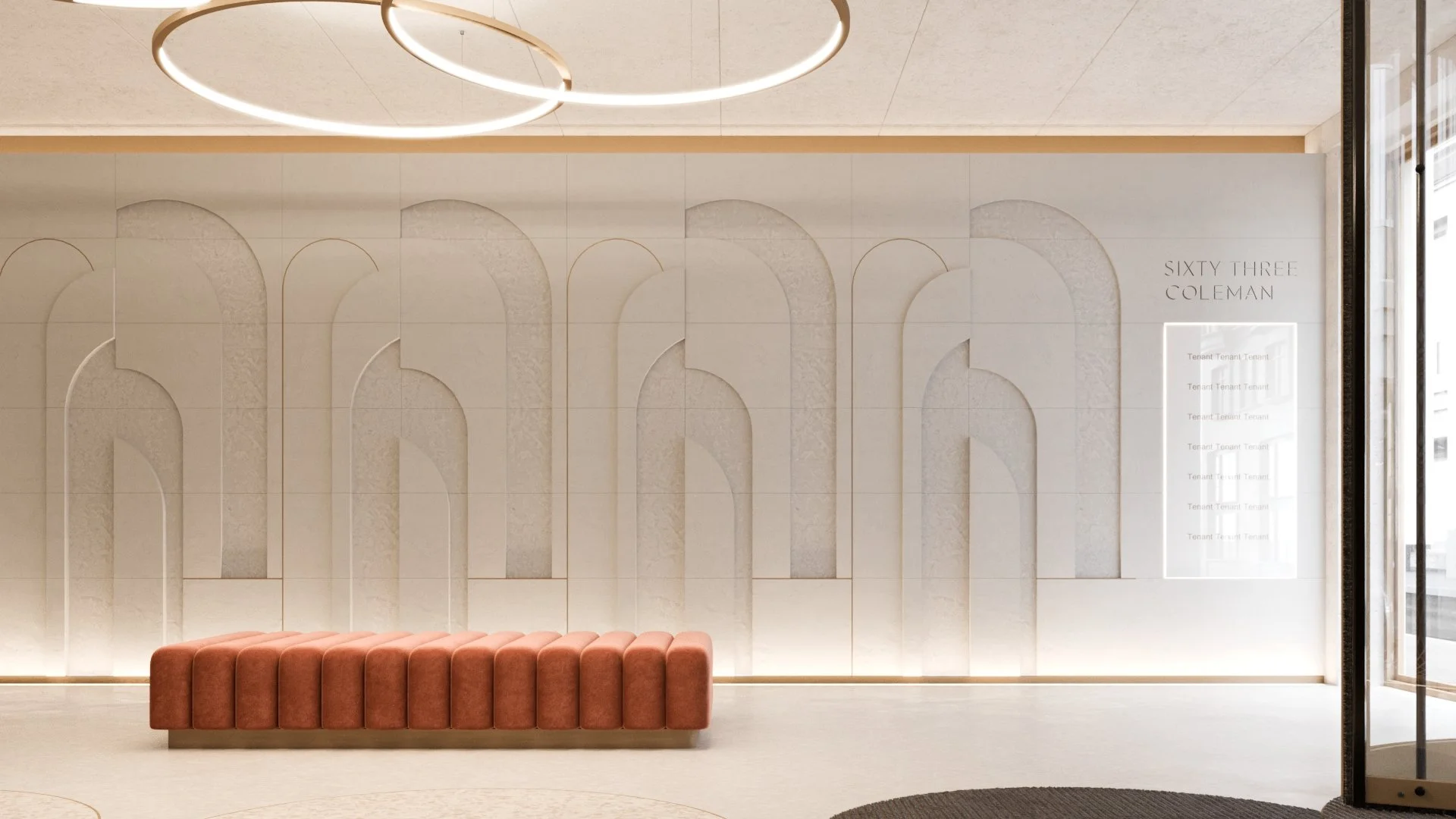 Modern interior lobby with white patterned wall, circular ceiling lights, pink upholstered bench, and a glass door on the right.