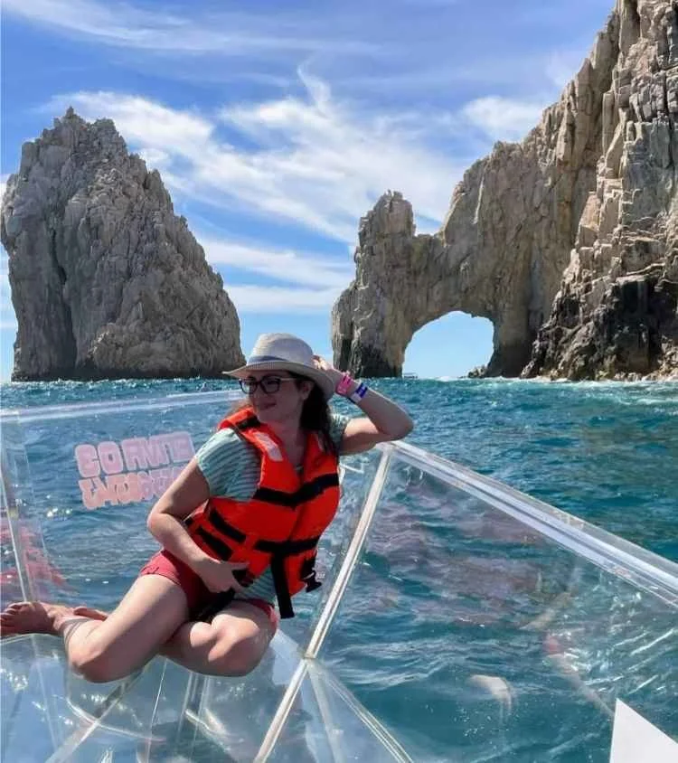 Karen Tatum on glass-bottom boat at Land's End, Los Cabos sea arches, Mexico