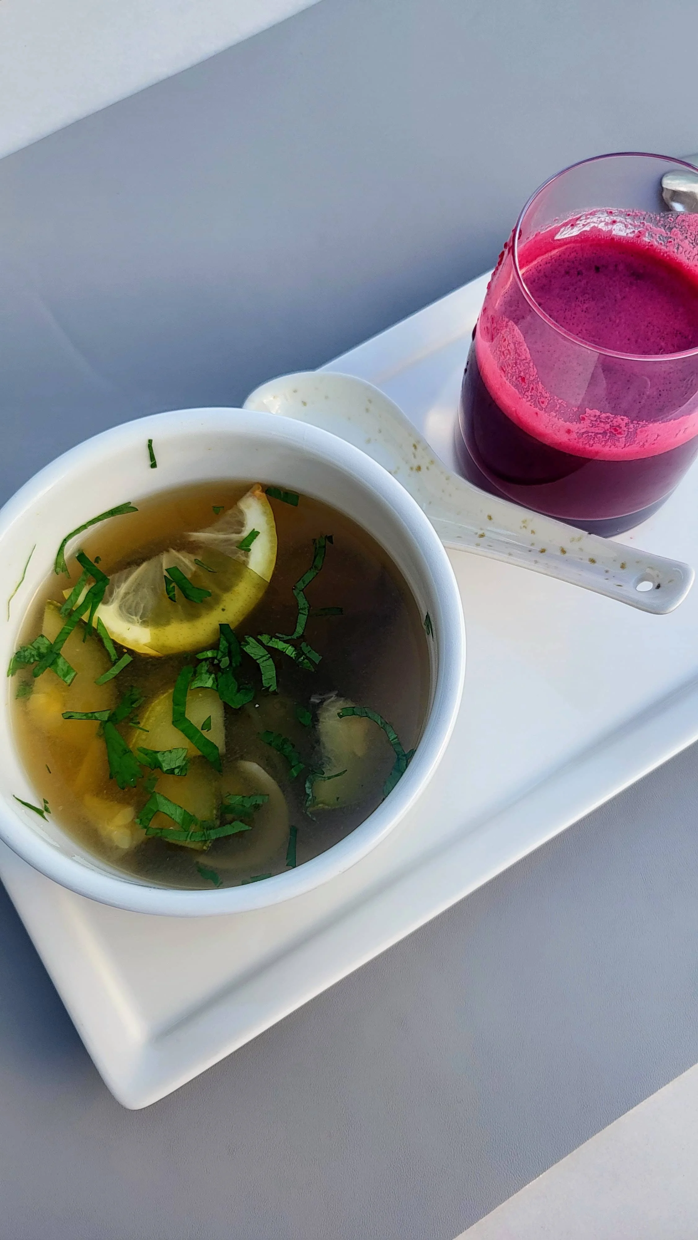 ealthy breakfast at SHA Wellness Mexico with miso soup, acai and beet juice shot