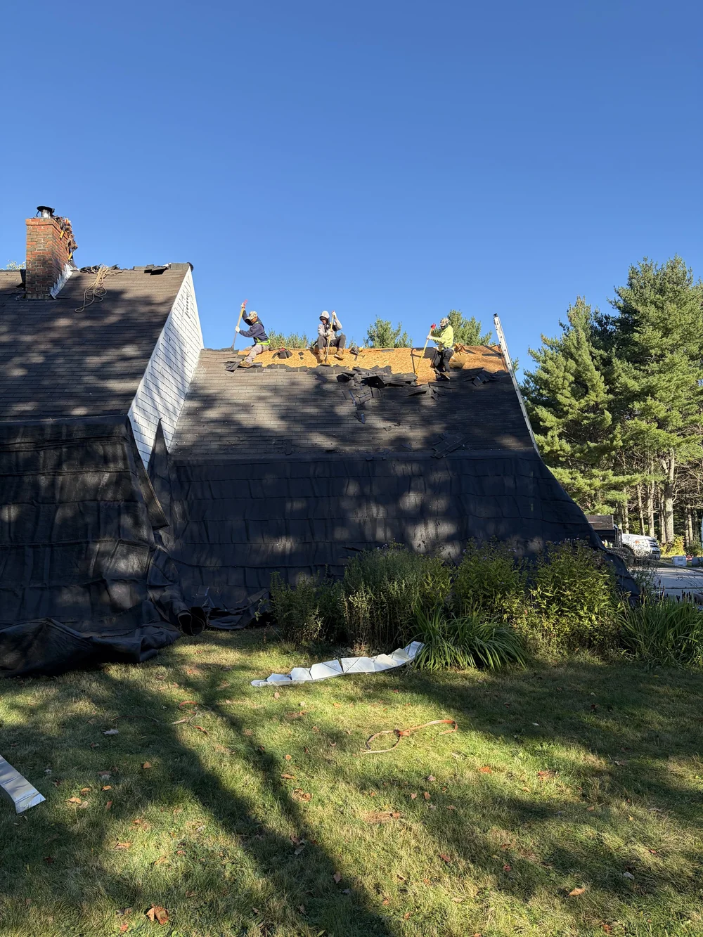 TopDog crew removing the existing roofing at the Lyman home