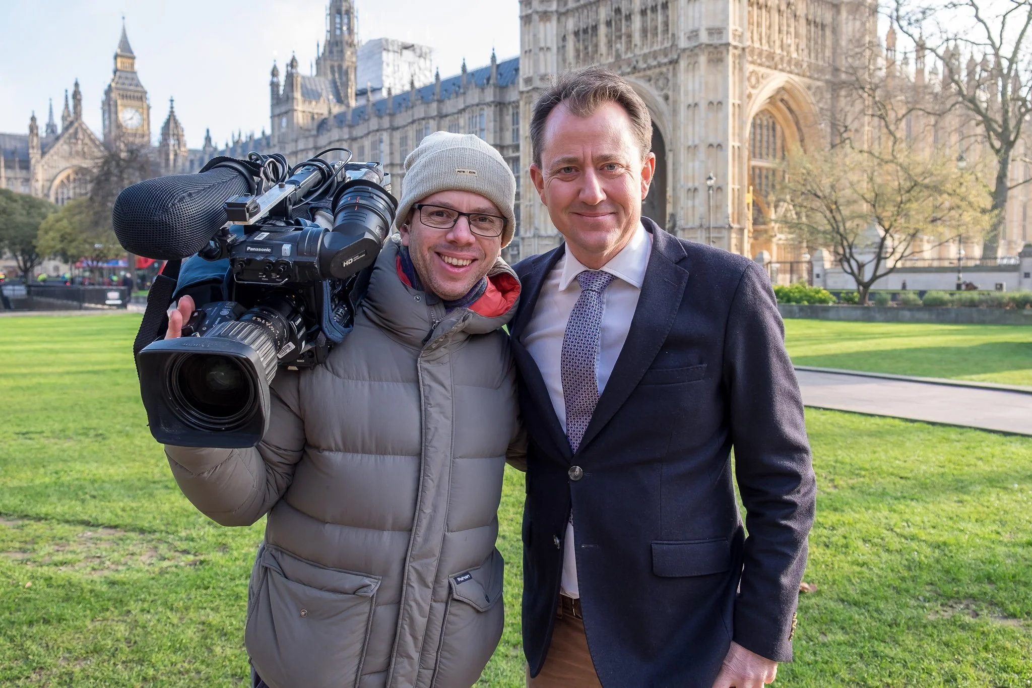 Matt Freestone with television camera alongside Richard Gaisford, shooting for ITV outside the UK House of Parliament