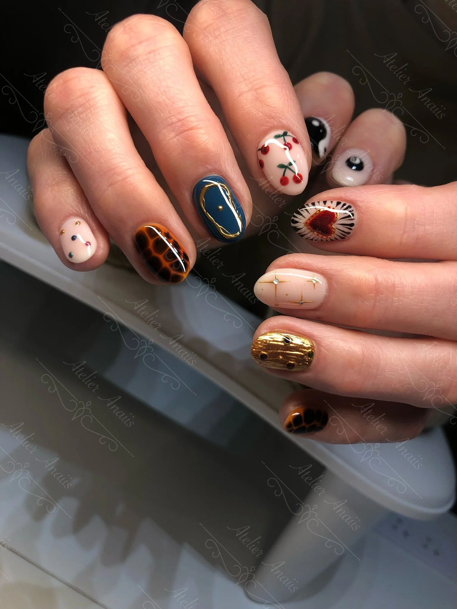 Multifaceted Embossed Nails with Animal Patterns, Stars, and Cherries