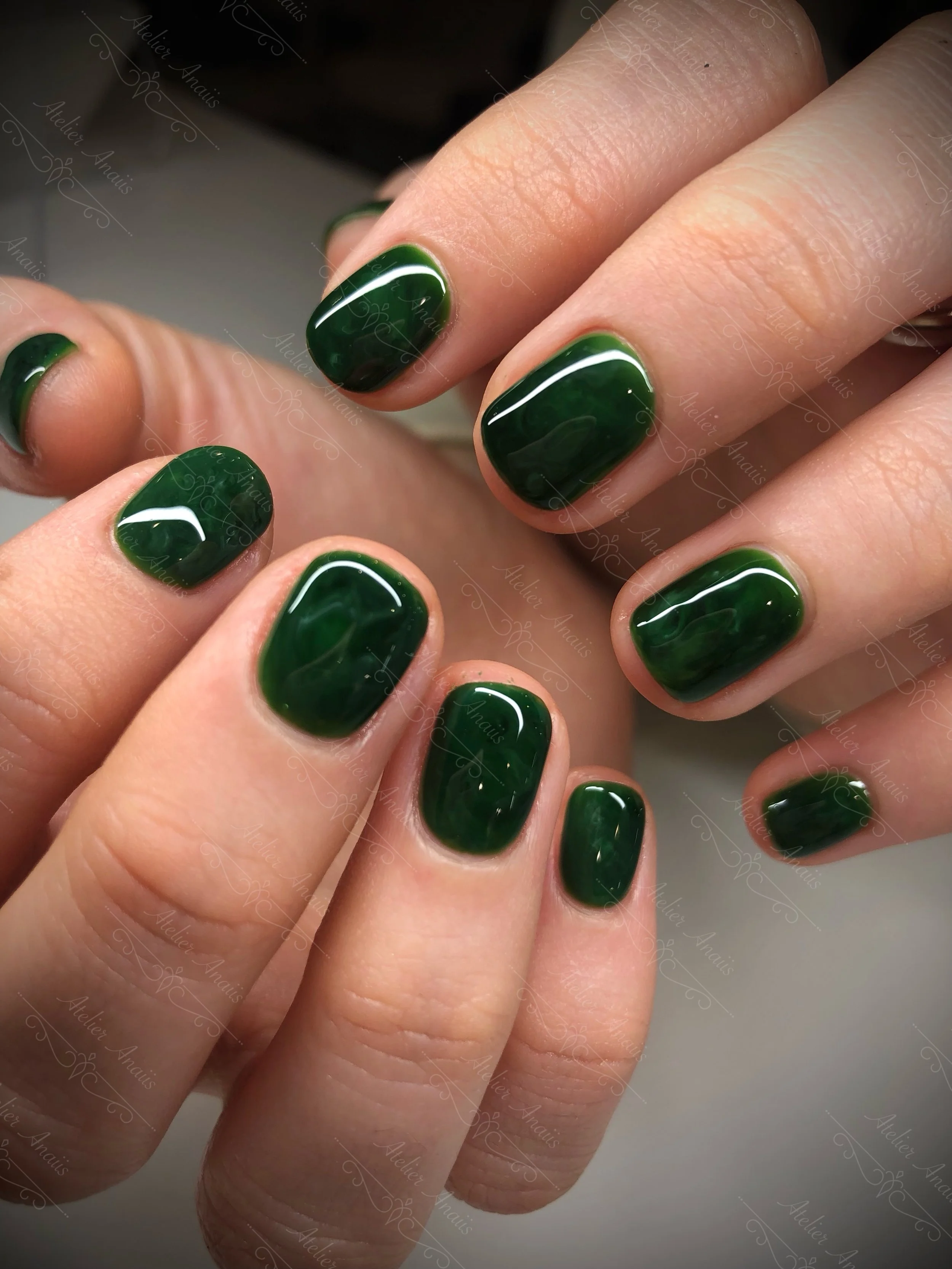 Hands featuring Classic British Racing Green and Eagles marbled Green on Short Nails for All Seasons
