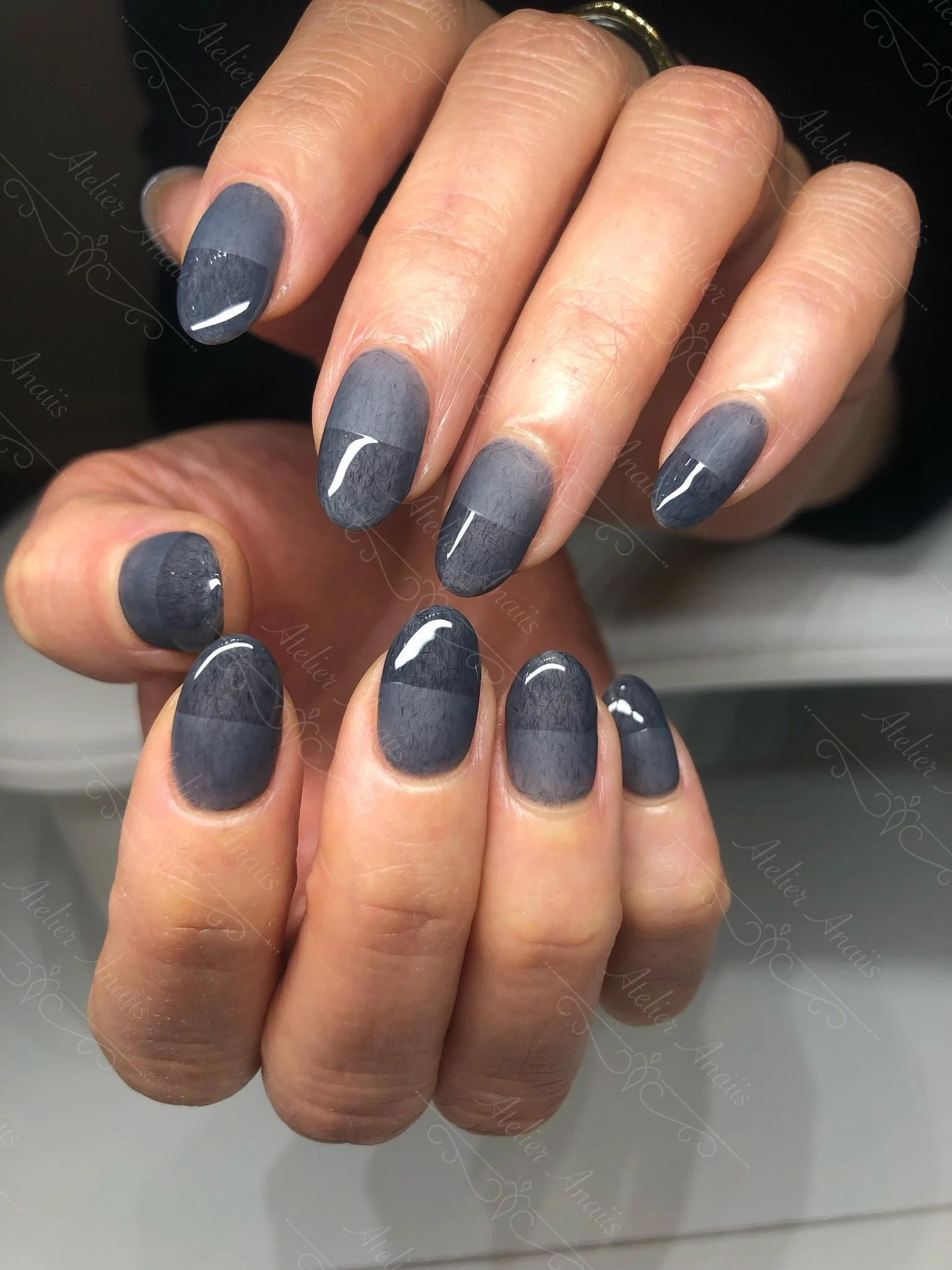 Medium length nails with color block Japanese nail art in glossy and matte slate gray. 