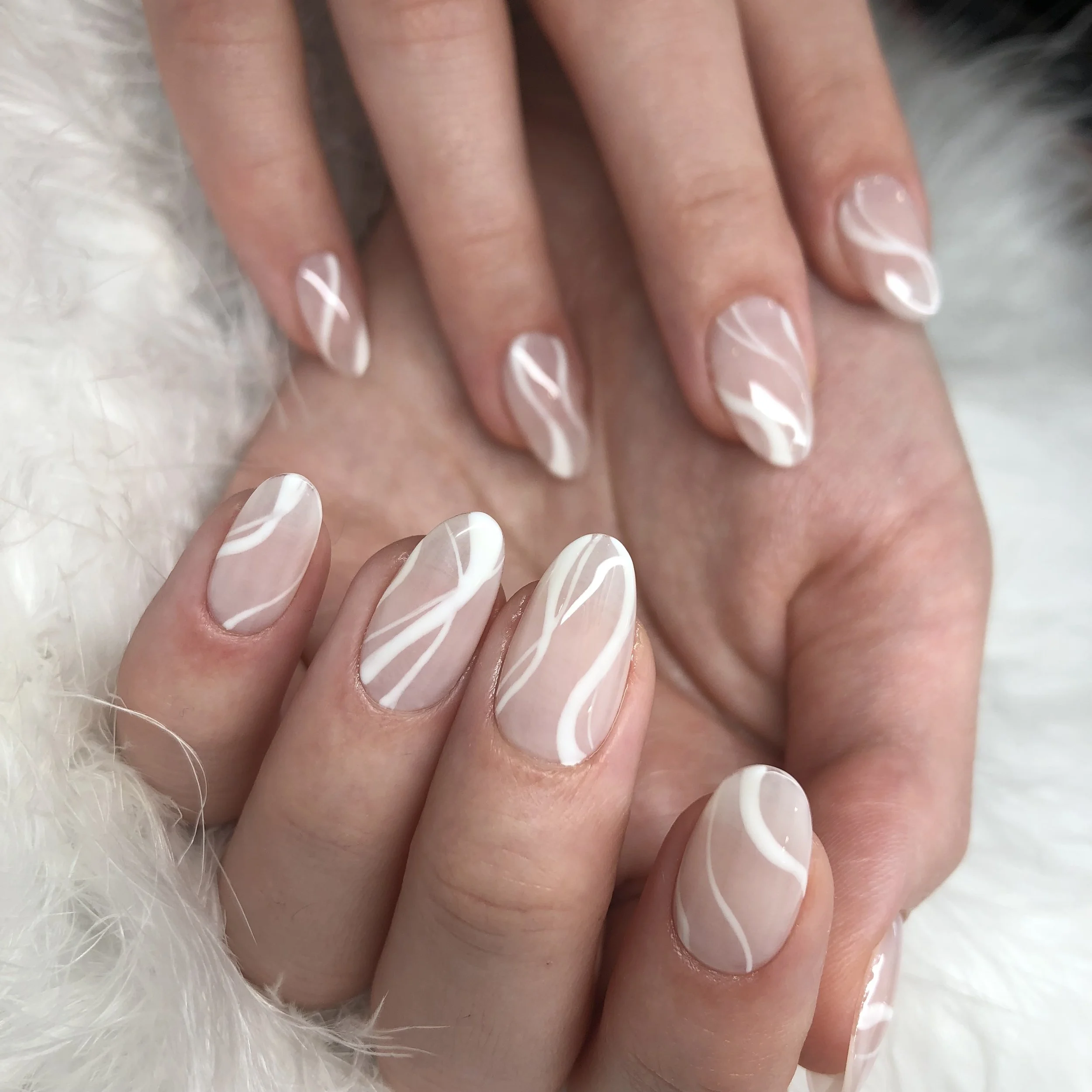 Abstract nails featuring white line nail art at a nail salon in Old City. 