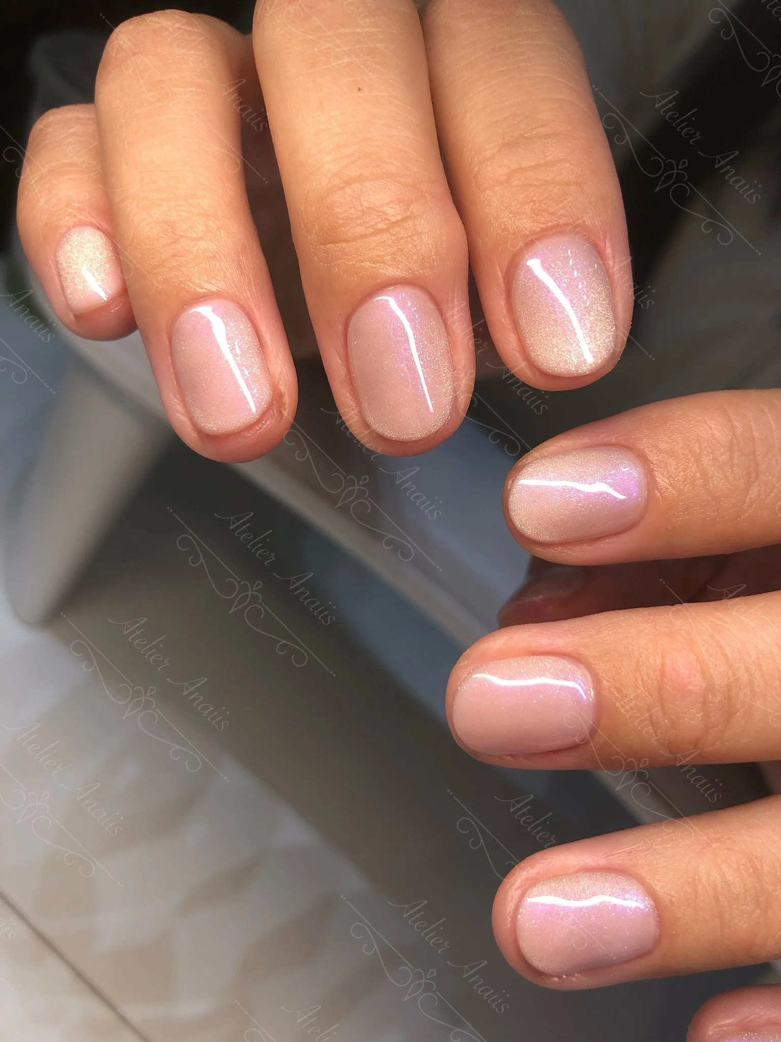 Short nails featuring a nude pink cat-eye velvet gel polish.