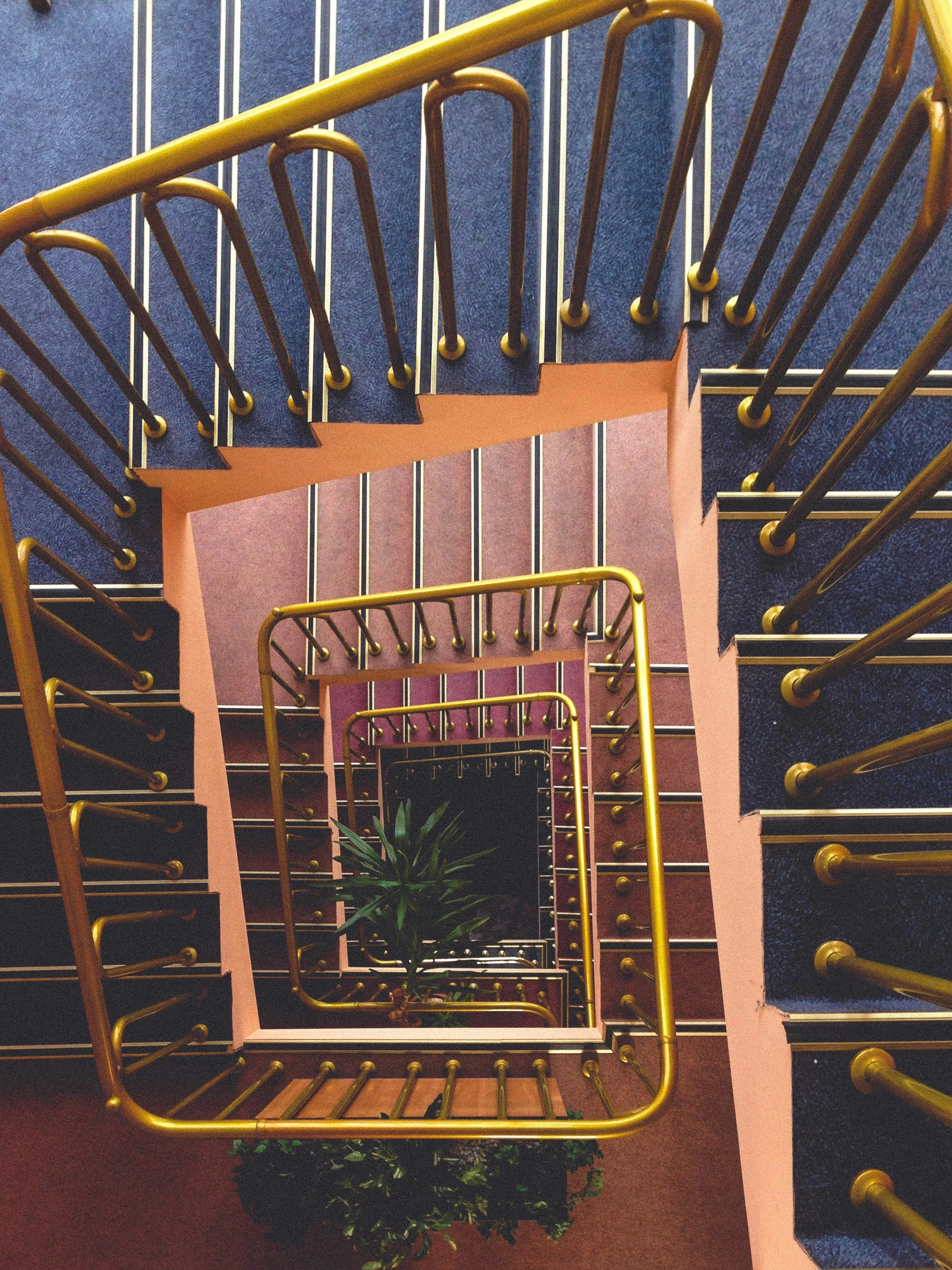 Cover image of a winding staircase for a blog post from Atelier Anaiis on why cuticle picking strategies fail.