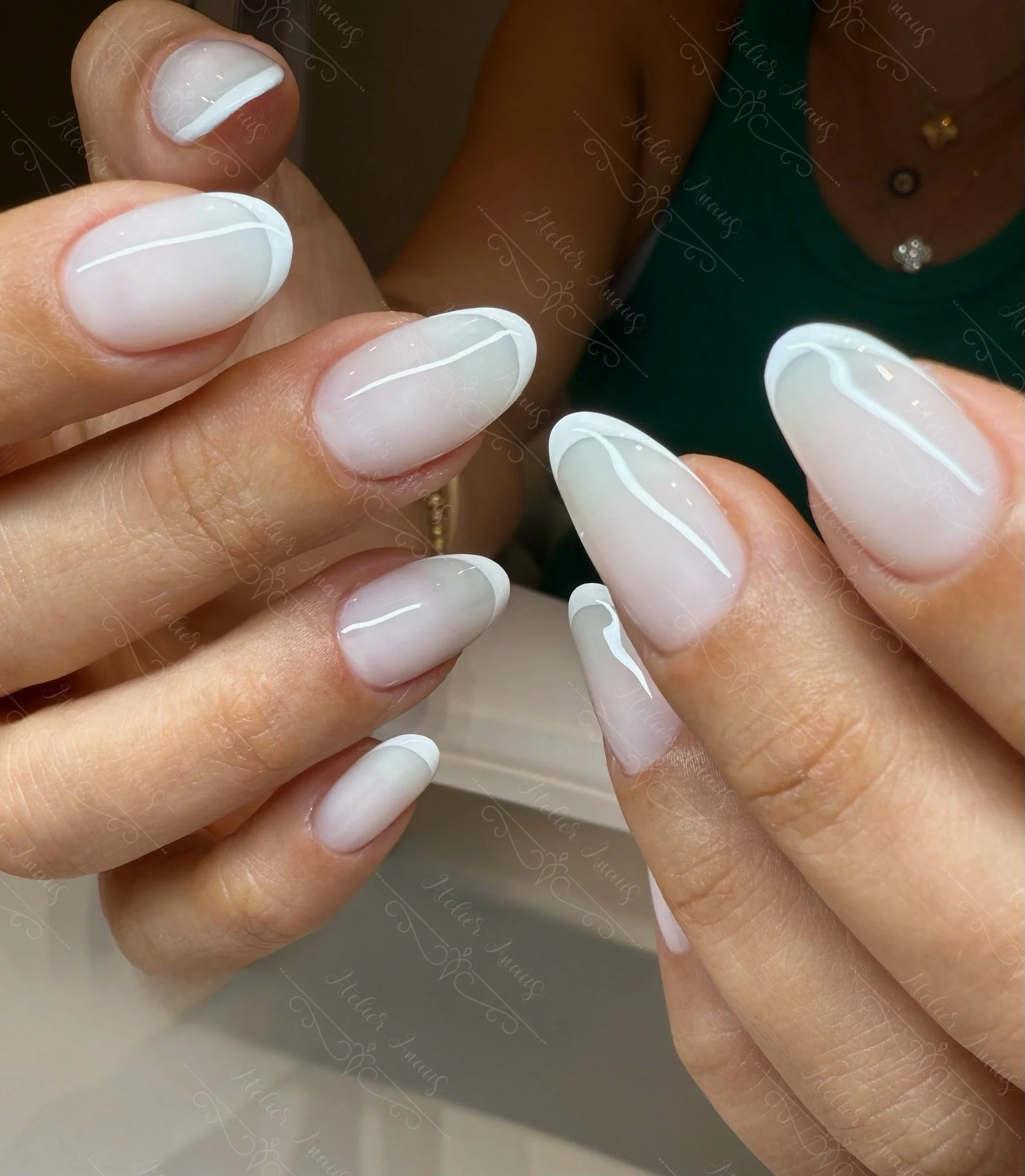 Bridal nails featuring white French tip nail art on white ombre base at a nail salon in Old City.