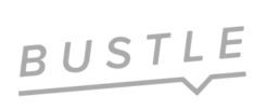 The word 'BUSTLE' written in white, stylized text with a swooping underline.