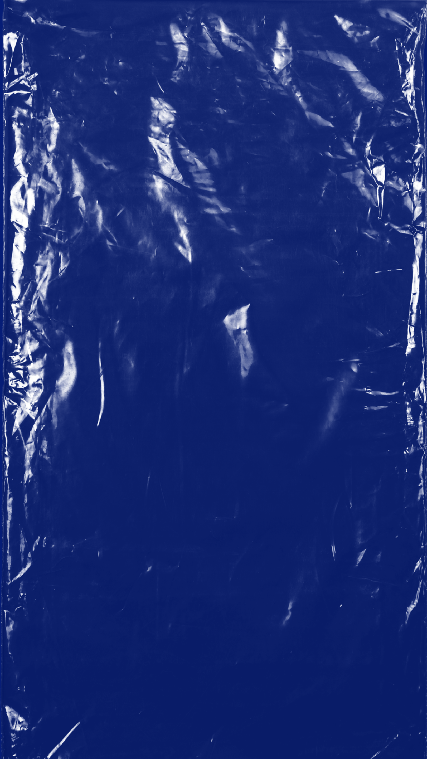 Blue plastic or foil material with crinkled and reflective surface.