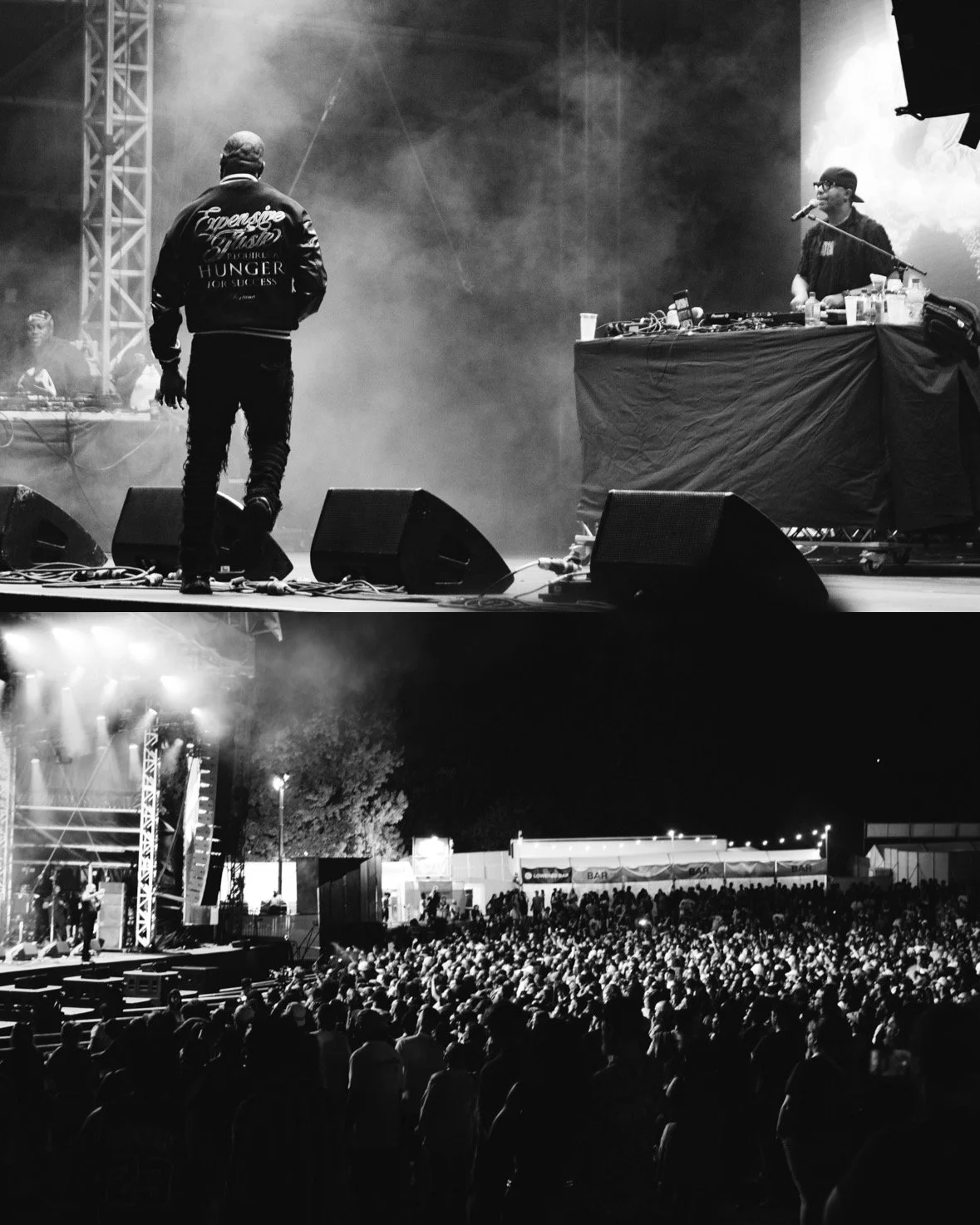 A black and white photo of a concert scene with a large crowd watching a band perform on stage. The stage has lighting, speakers, and a DJ setup with a DJ behind it. The crowd is standing outdoors at night.