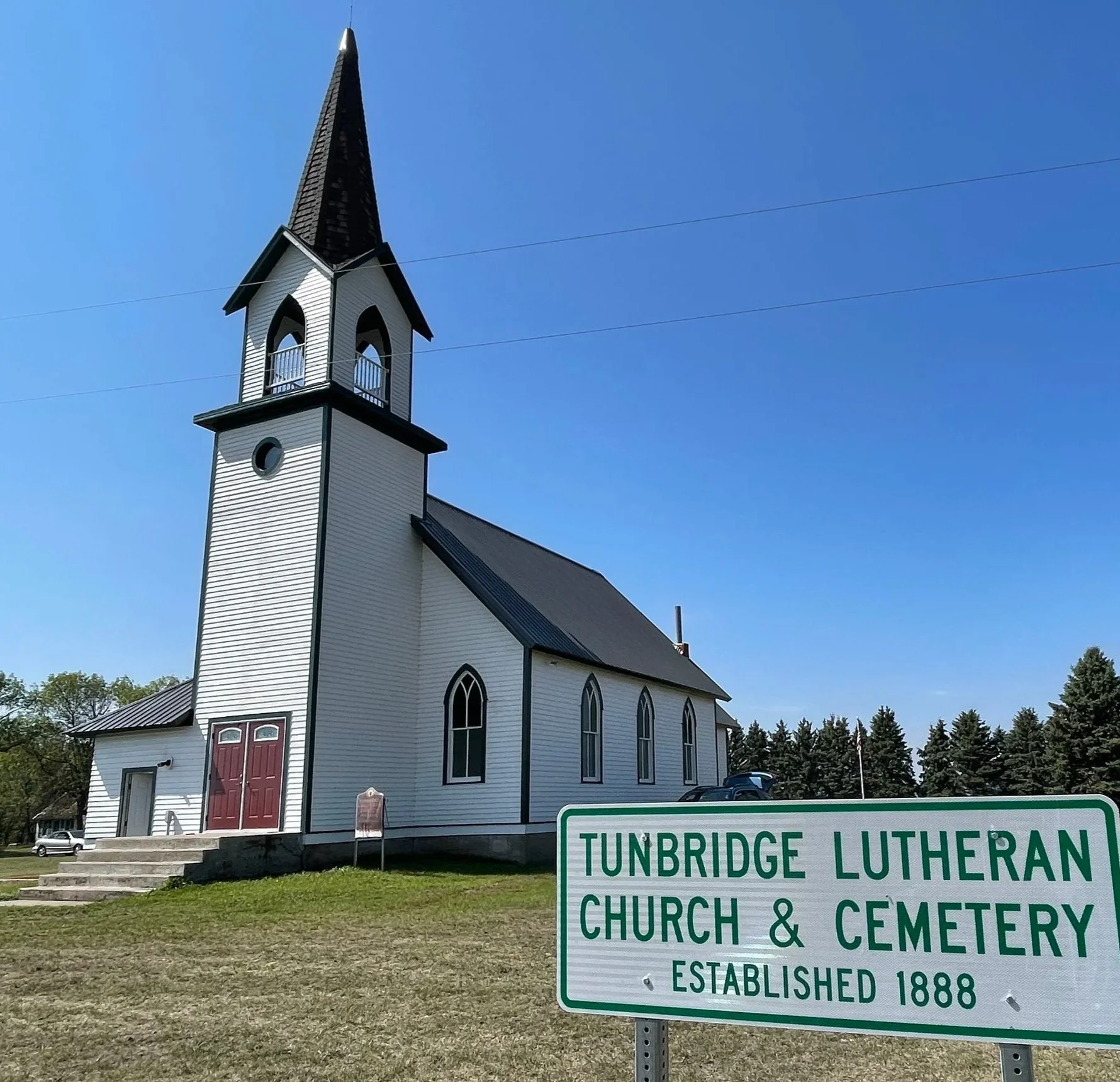 Tunbridge Lutheran Church and Cemetery with a sign noting the founding date of the congregation as 1888.