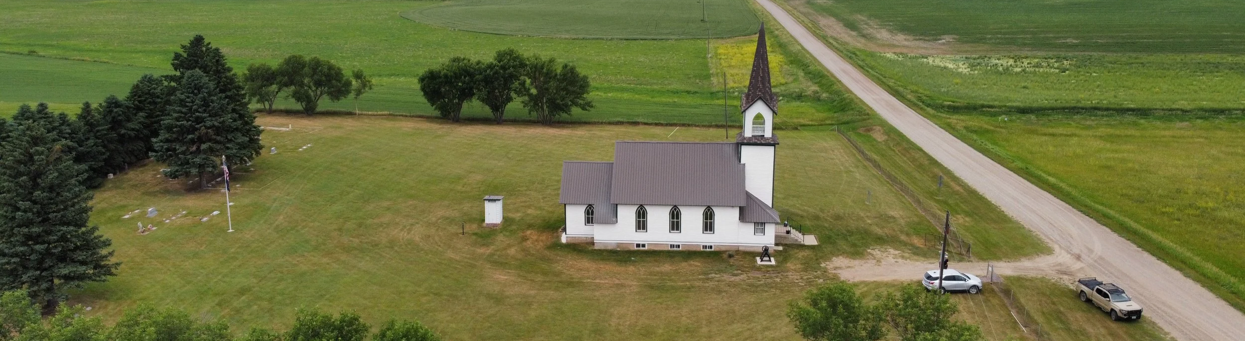 Aerial view of Tunbridge Lutheran Church and Cemetery surrounded by open green fields.