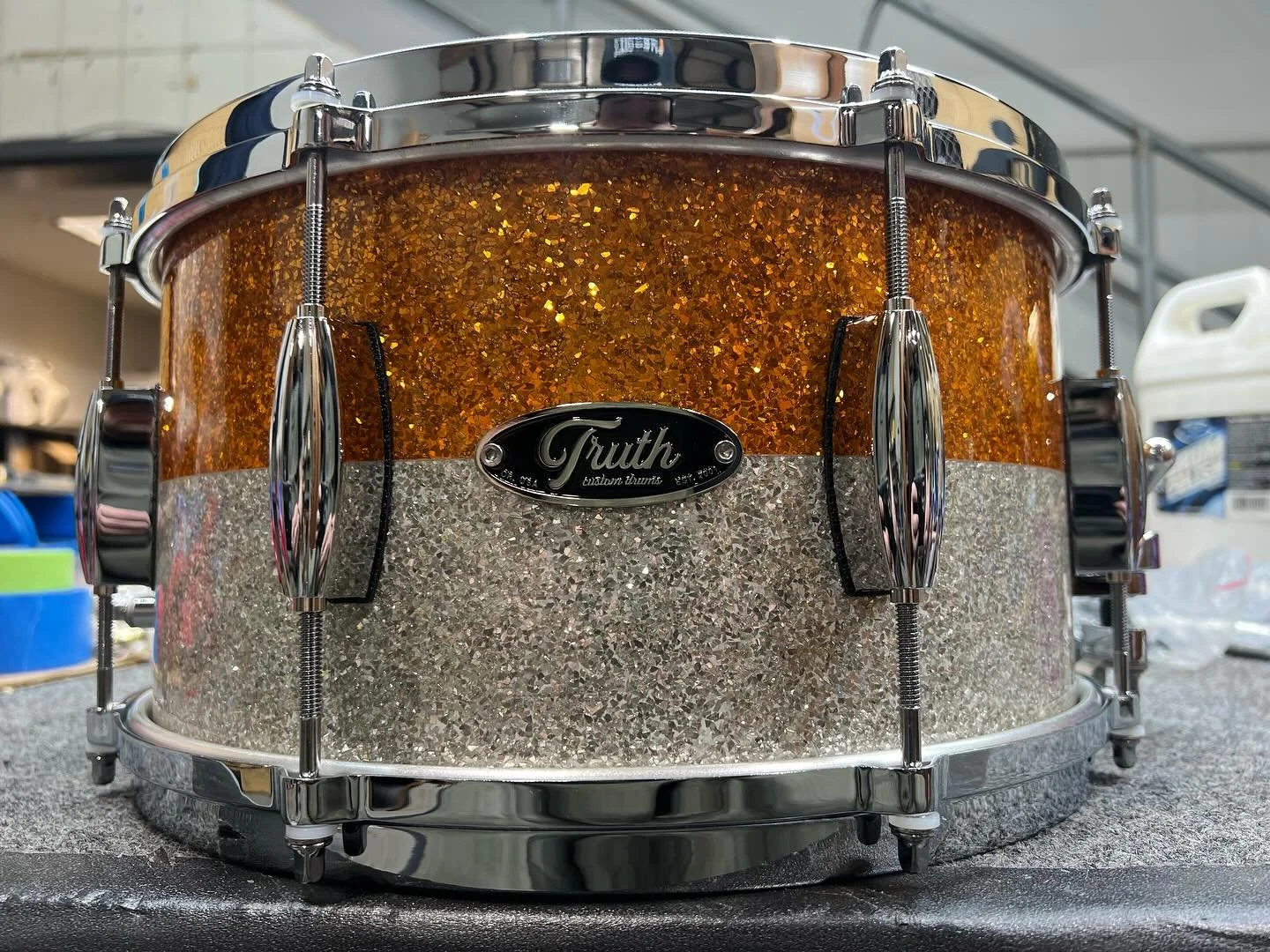 13x7, 10 ply maple, orange and silver glitter 50/50 finish, beavertail lugs with die cast hoops!  Sound as good as it looks!
#customdrums #truthcustomdrums #drums