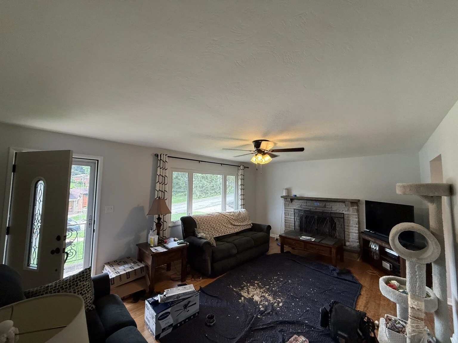 After: Completed living-room ceiling fan and light installation.