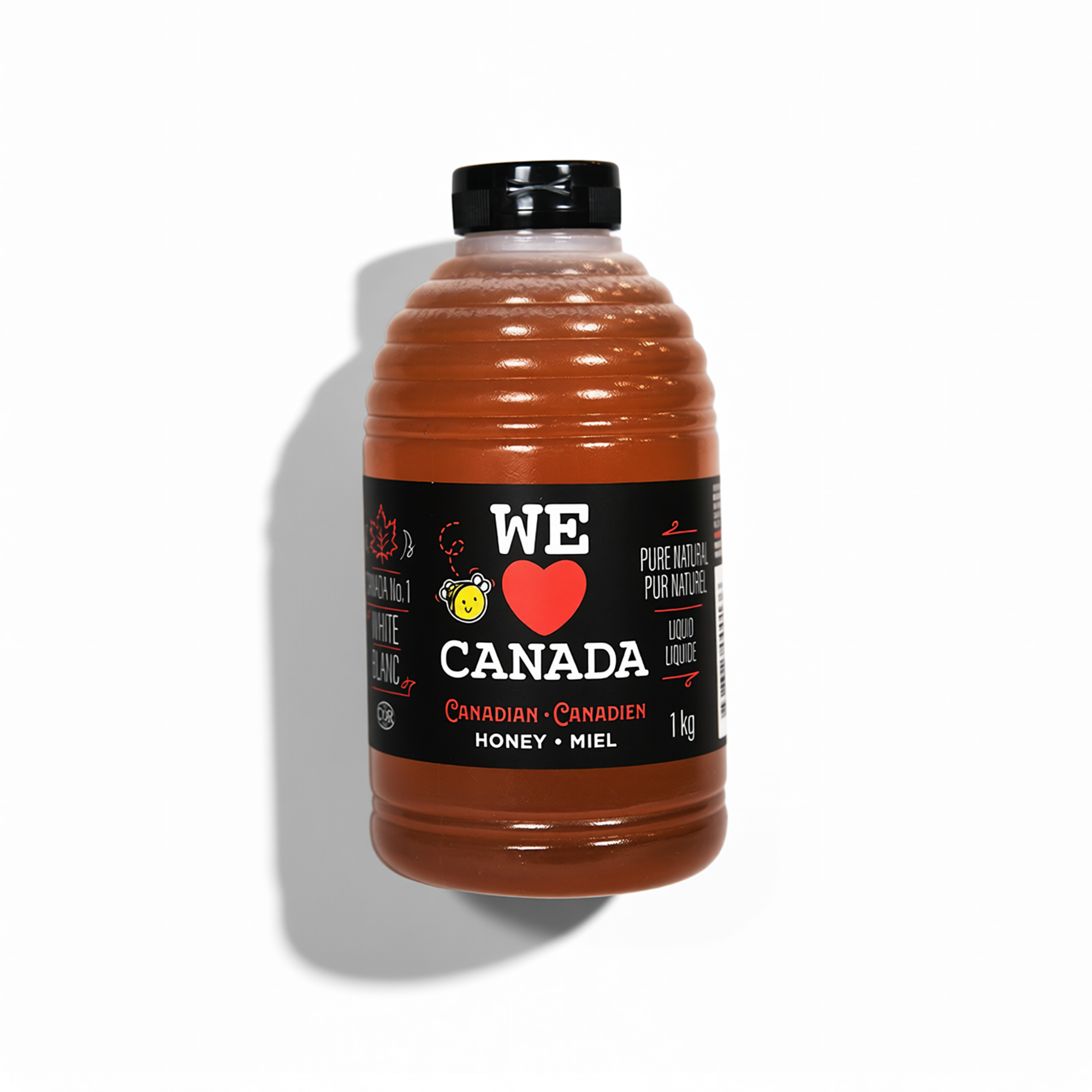 A jar of Canadian honey with a black label that reads "We Love Canada," includes a small bee illustration, and states 'Pure Natural Honey' and '1 kg'