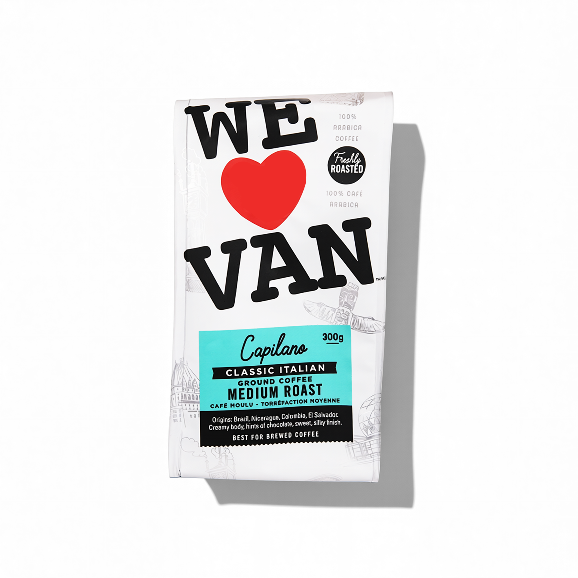 A bag of Capilano classic Italian medium roast ground coffee with 300 grams. The packaging is white with black, red, and blue text, featuring a red heart and a shadow of the bag casting a shadow on the white background.