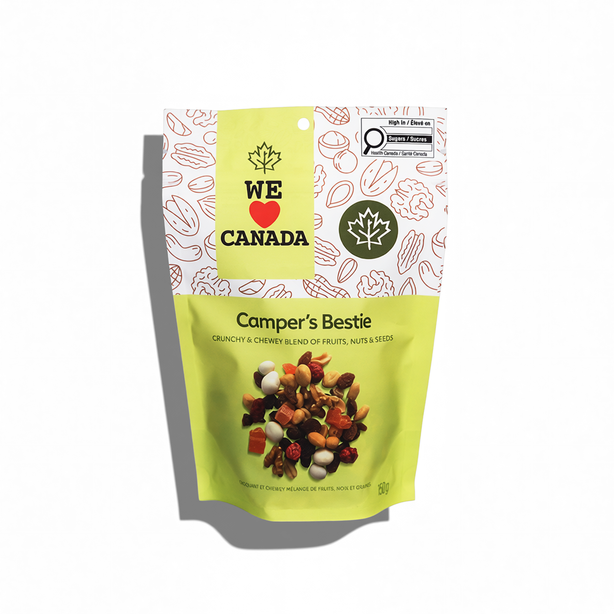 A bright yellow and white bag of Camper's Bestie trail mix, featuring a picture of mixed dried fruits, nuts, and seeds, with a Canada-themed label and a maple leaf logo.