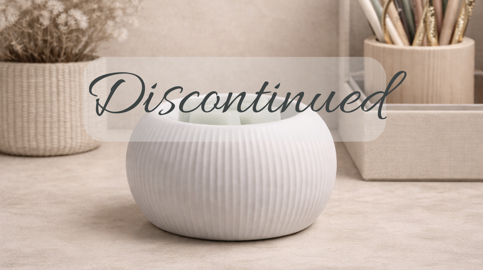 scentsy discontinued products with a white warmer