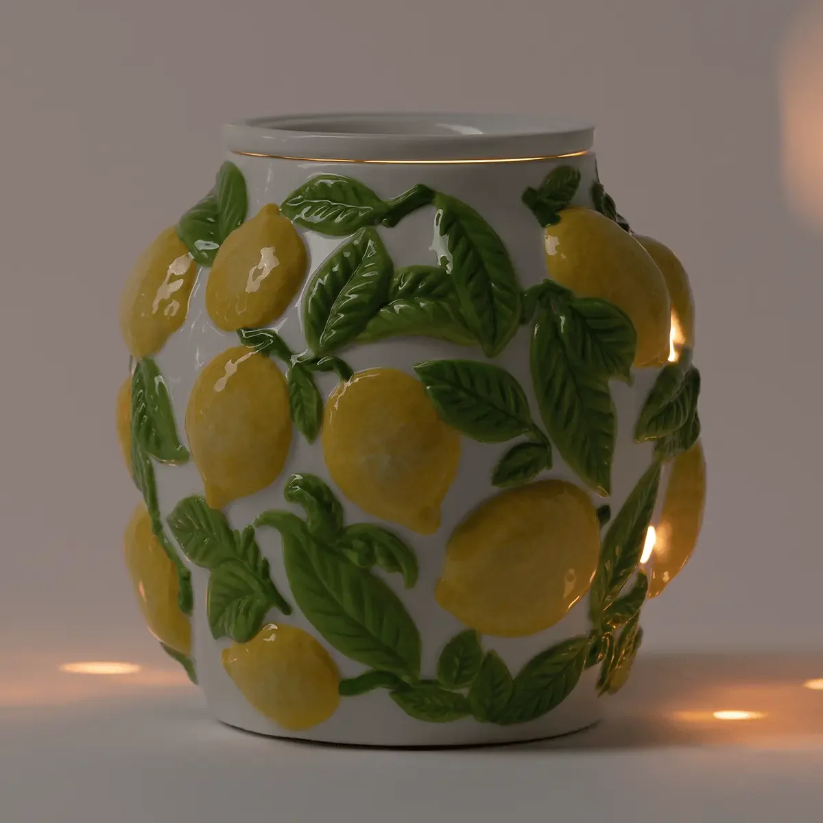 Amalfi Limone Scentsy Warmer glowing in a dark room, highlighting the embossed lemon design and warm ambient light