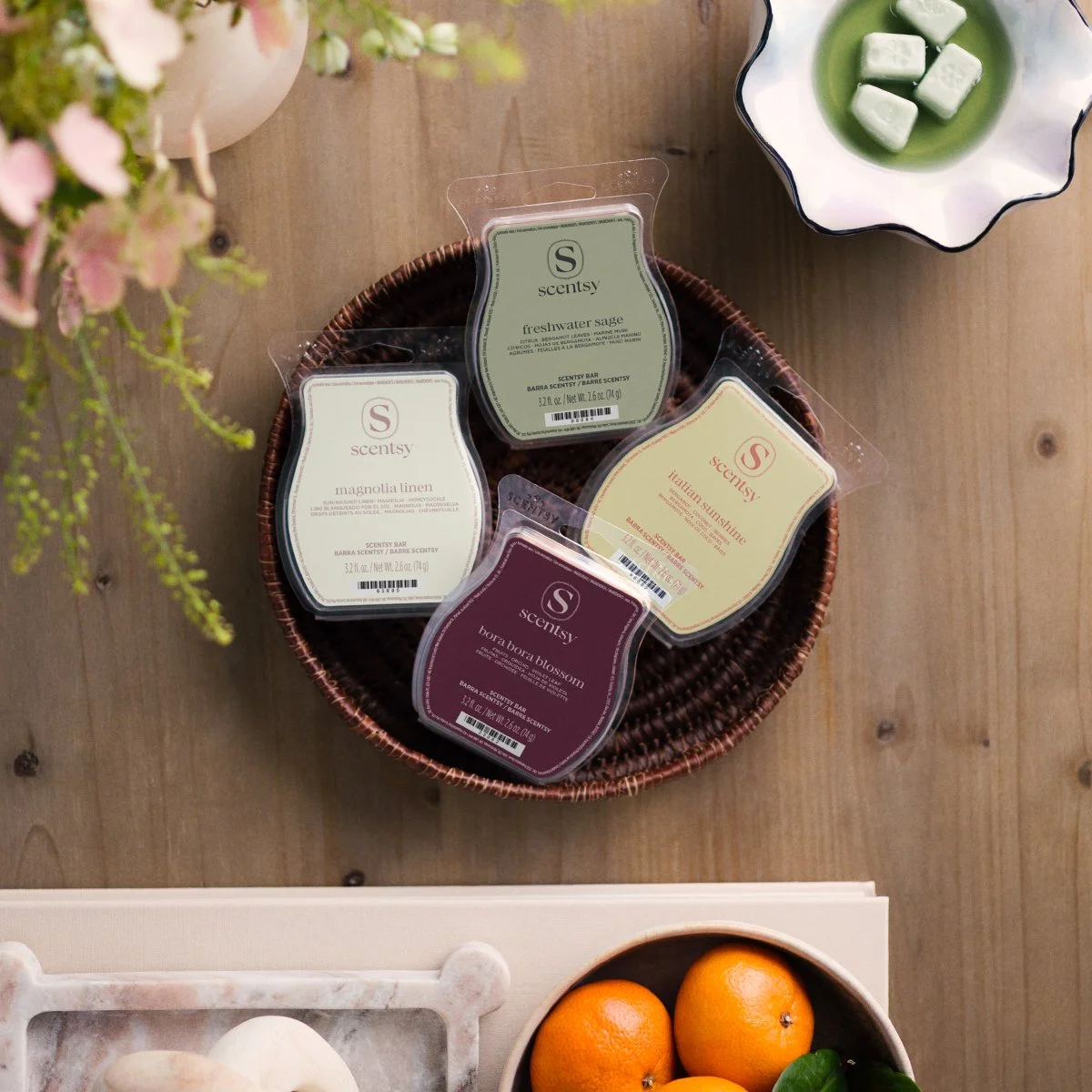 Scentsy wax bars displayed in a basket featuring multiple fragrance varieties